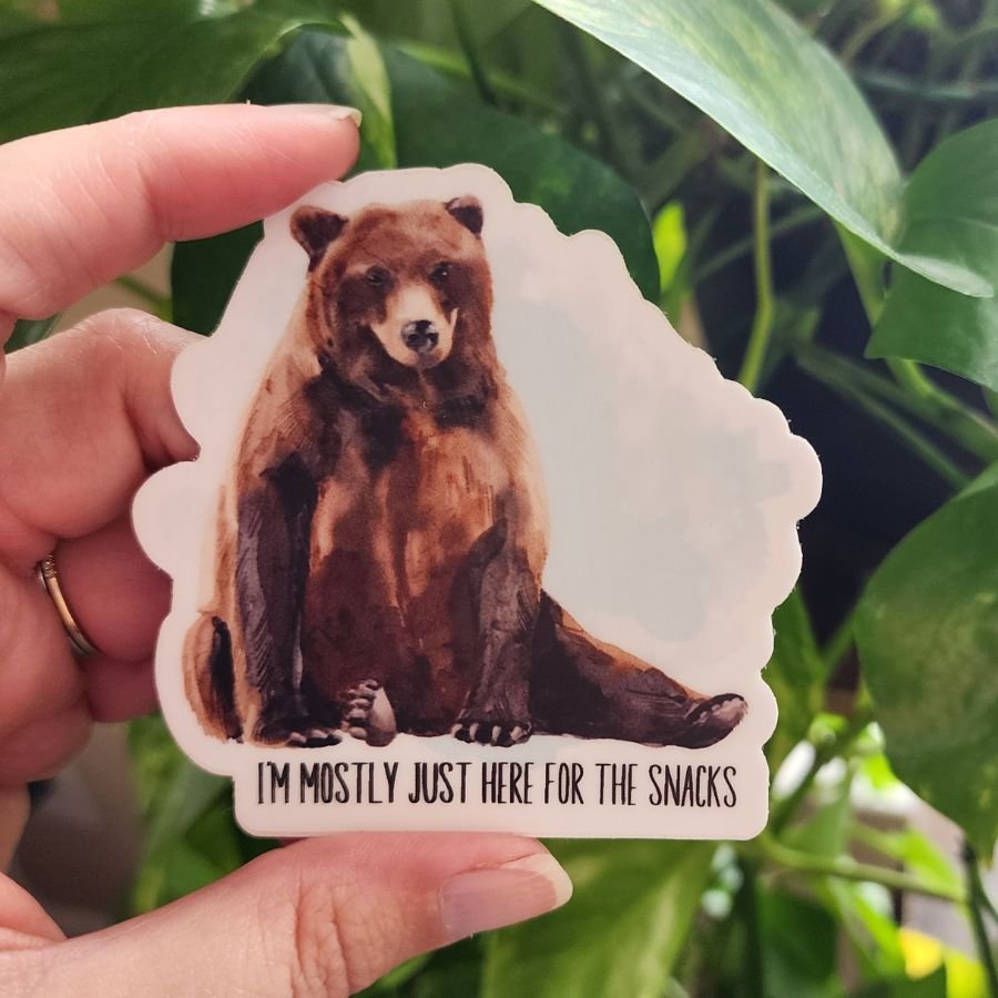 grizzly bear vinyl sticker with the quote im mostly just here for the snacks funny outdoorsy design for hikers campers and snack lovers