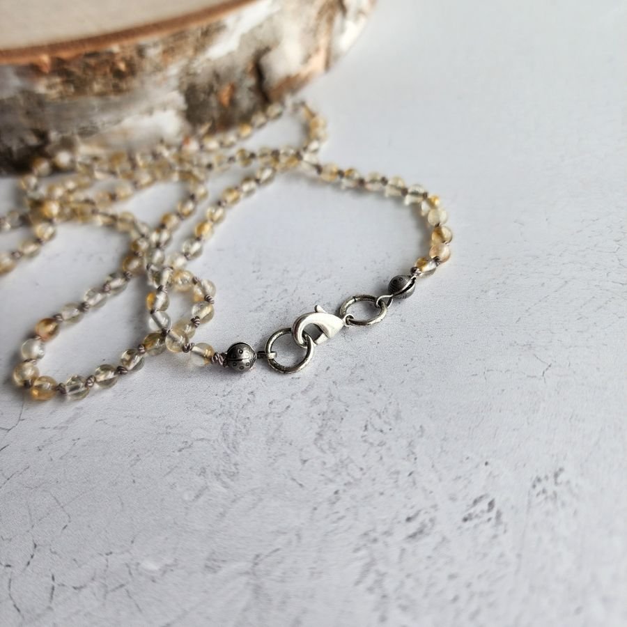 hand knotted citrine bead necklace with 4mm beads on pure silk cord finished with a silver lobster claw clasp handmade lightweight and elegant jewelry