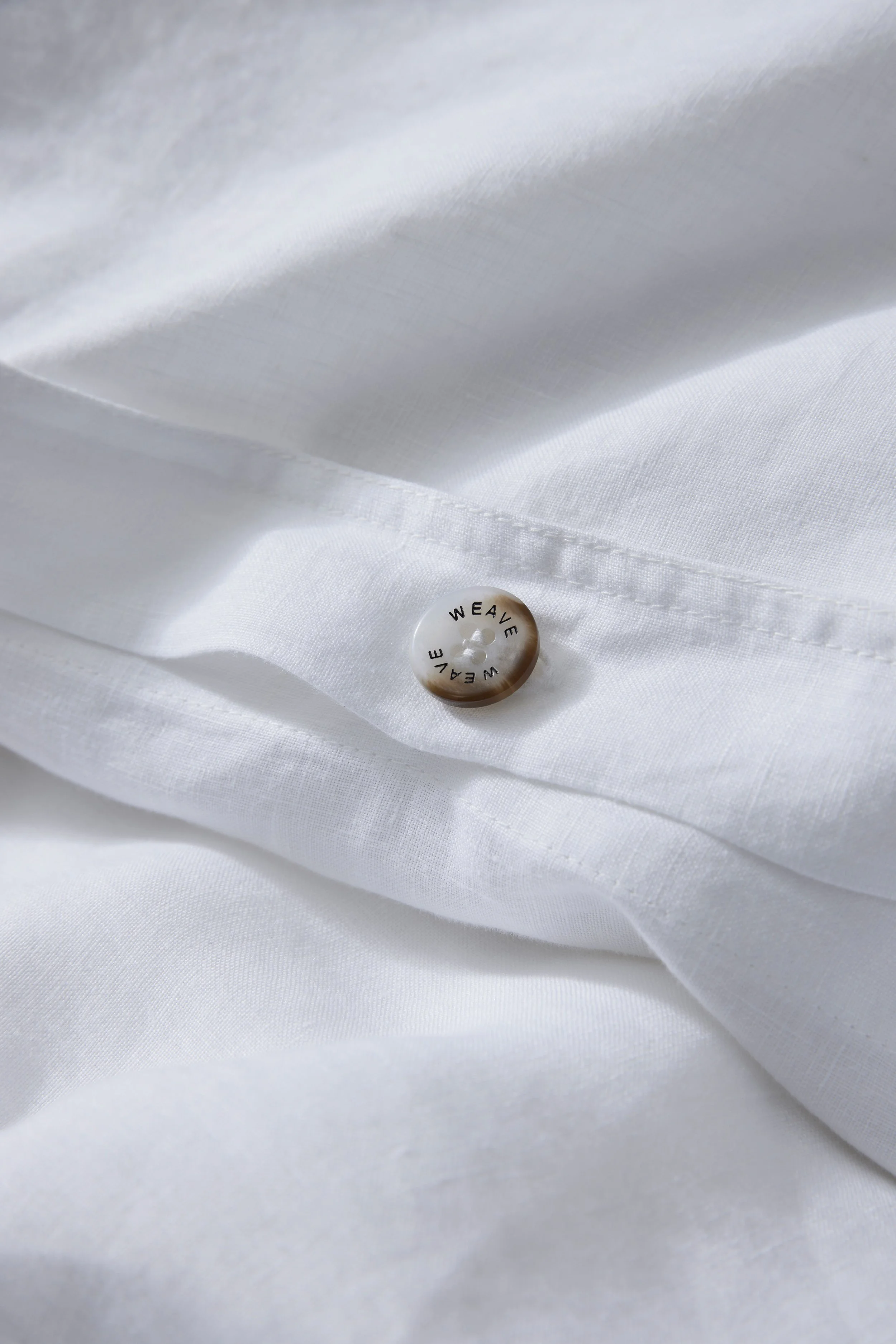 Weave_ravello_bedding_white_Button.jpg