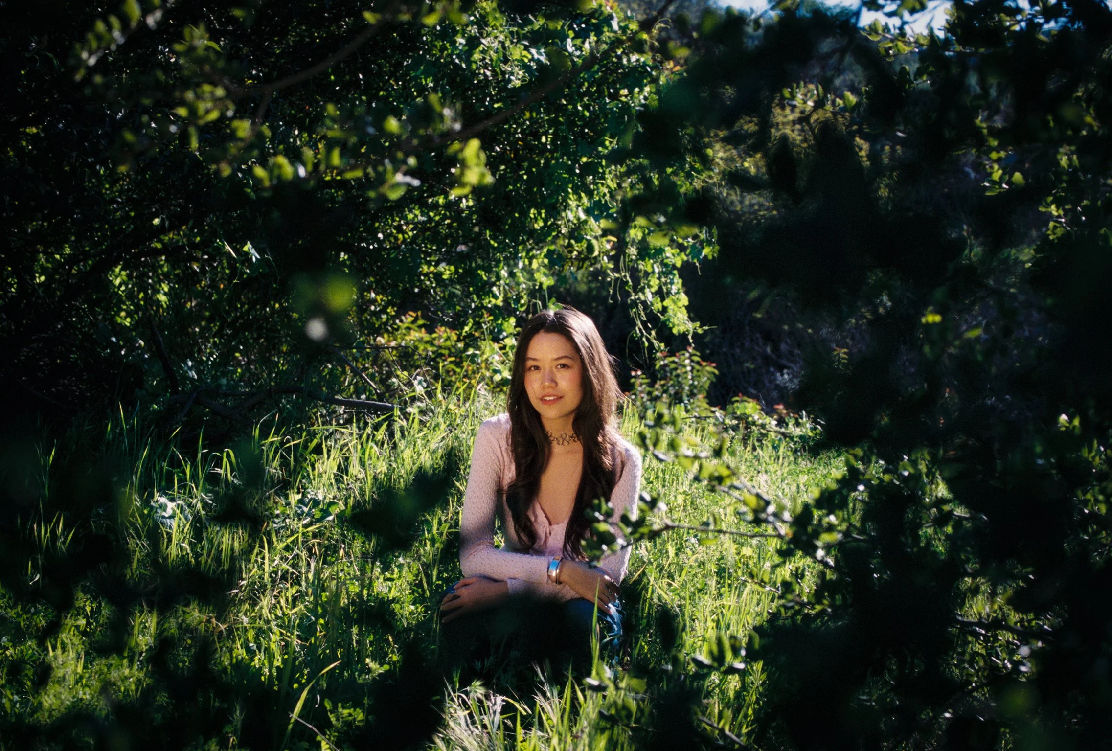 Girl sits in nature