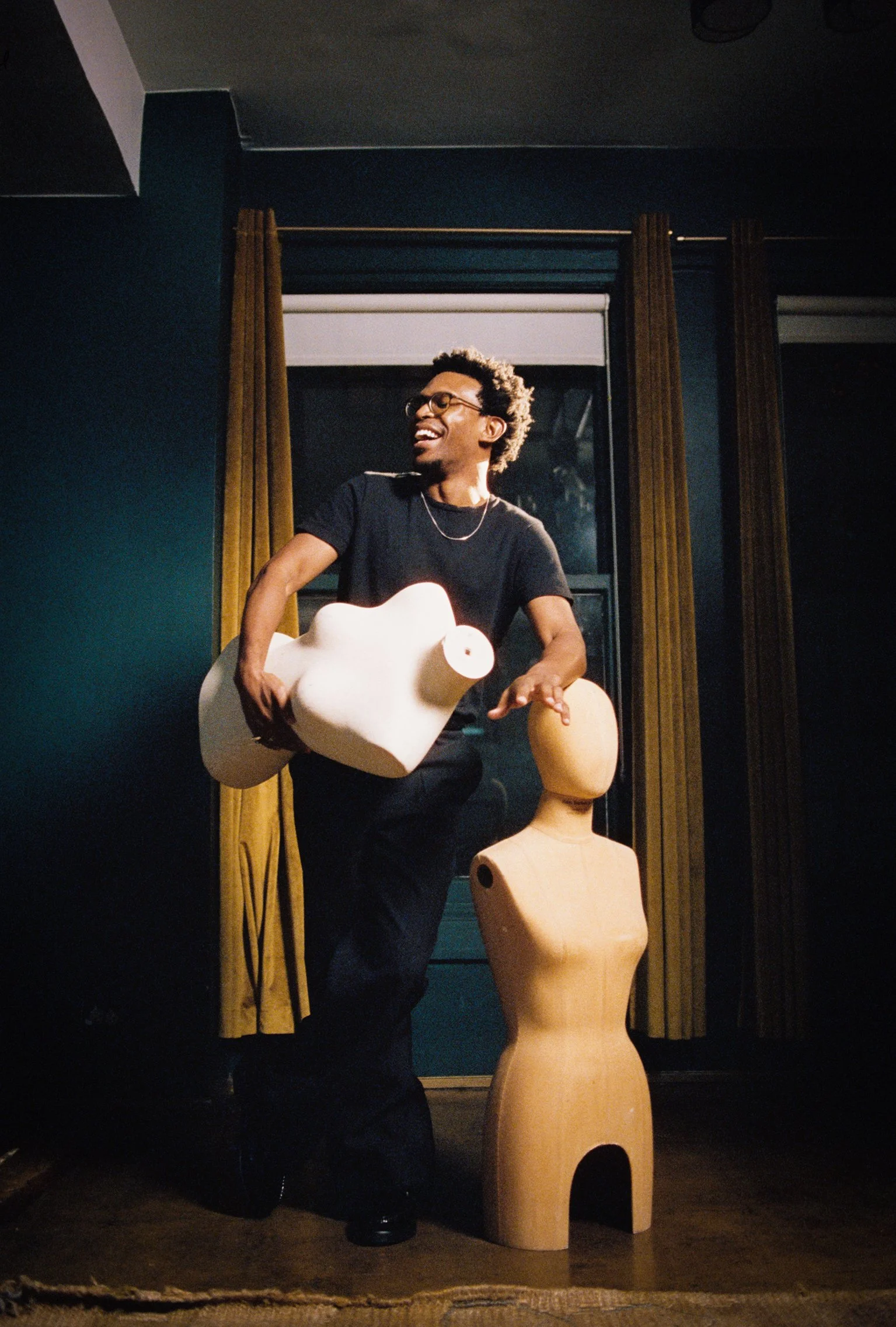 Camrus Johnson posing with props