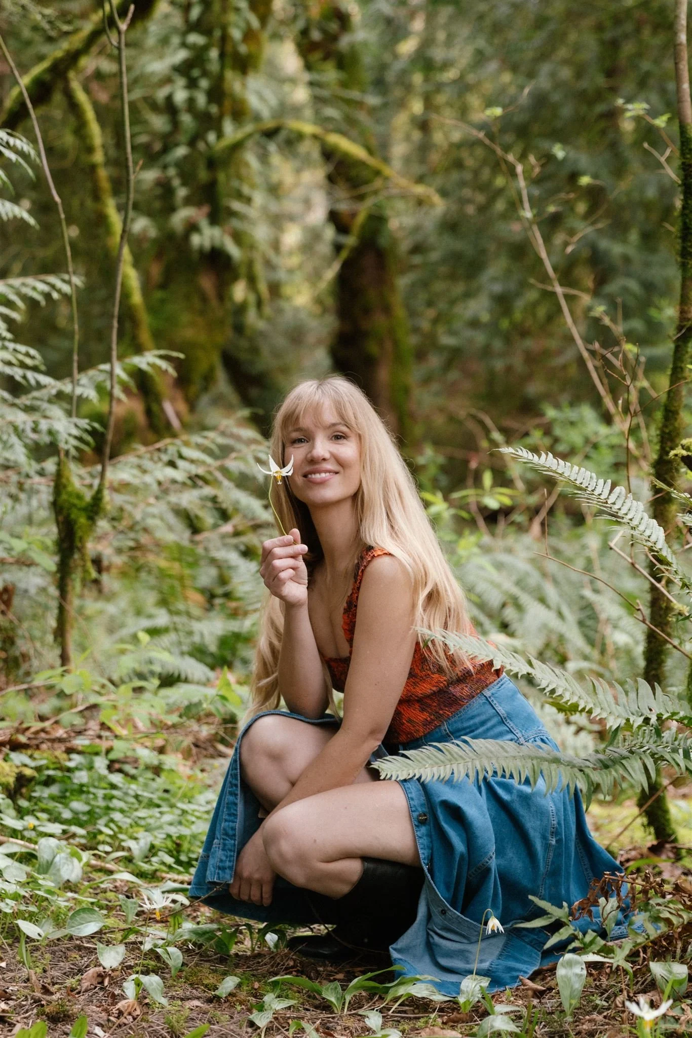 Woman holds flower in nature