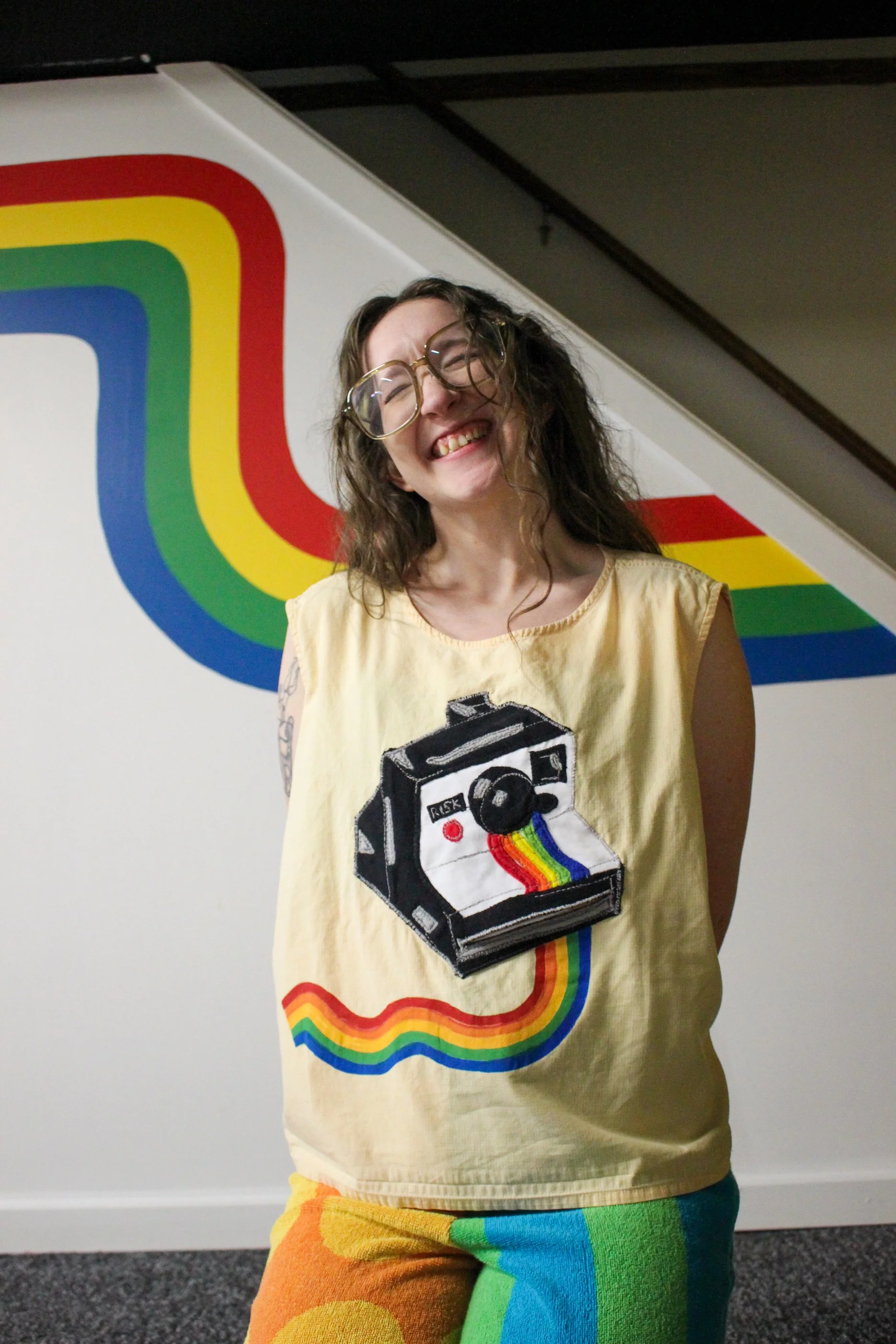 SIZE: Tagged a 3X, recommended for a 2X and smaller.
 PTP: 27” (68.58 cm)
BUST: 54” (137.16cm)
LENGTH: 22” (55.88cm)

MATERIAL: Cotton shirt, applique is other. Screen printing ink.

ETC: Interactive polaroid camera, with polaroid that comes out of t