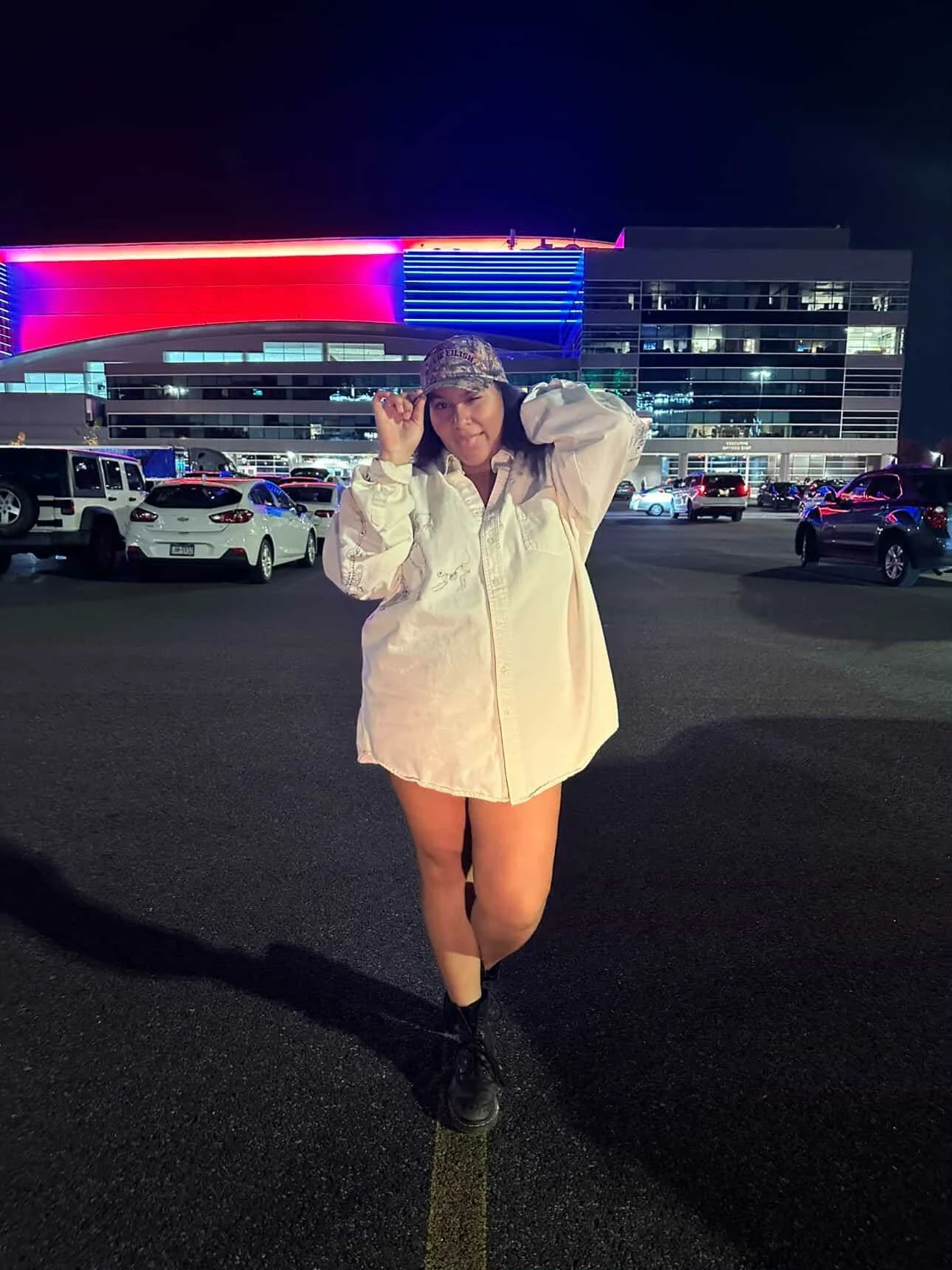 Lena at a concert with their Skeleton Button-up!