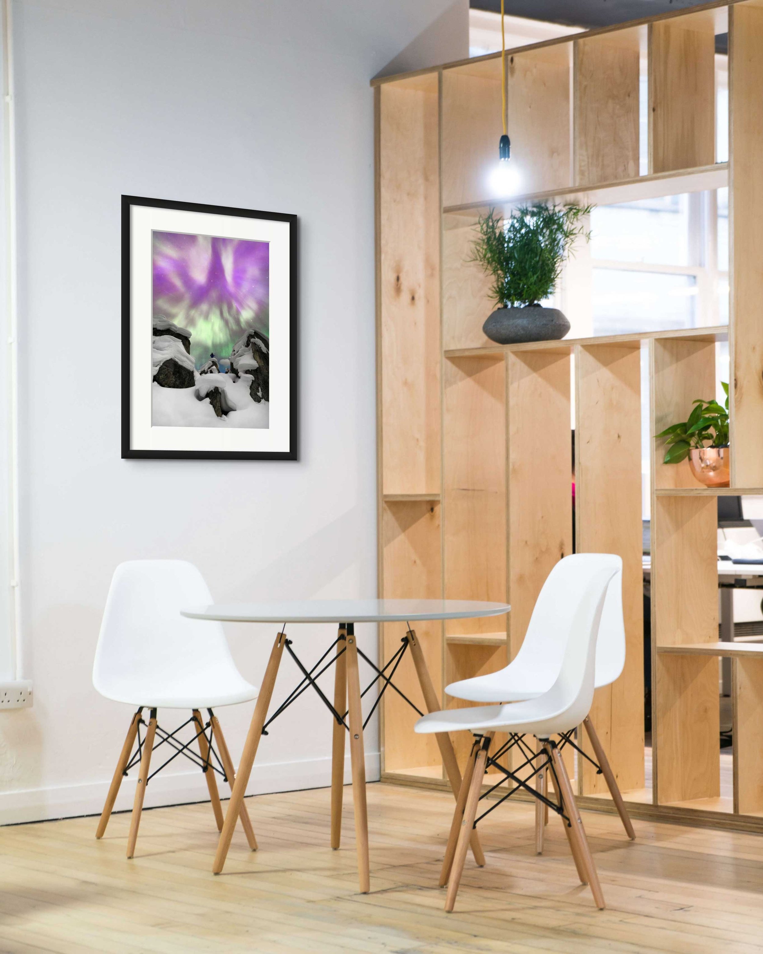 Mockup of a framed photograph in a modern room.