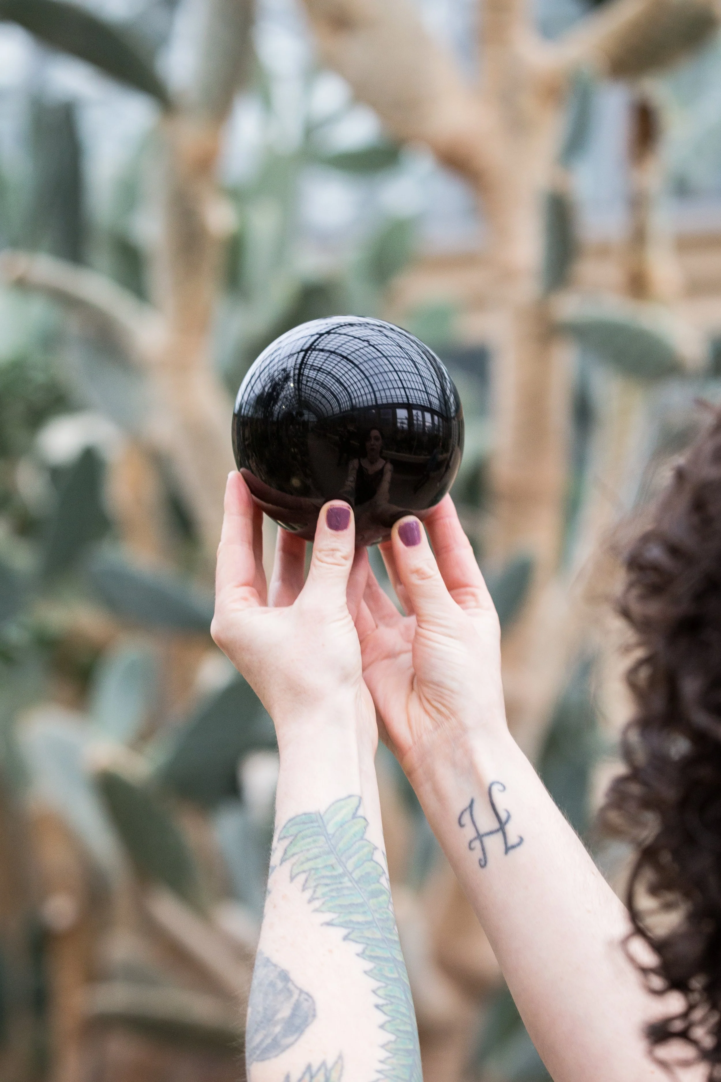 woman holding black ball
