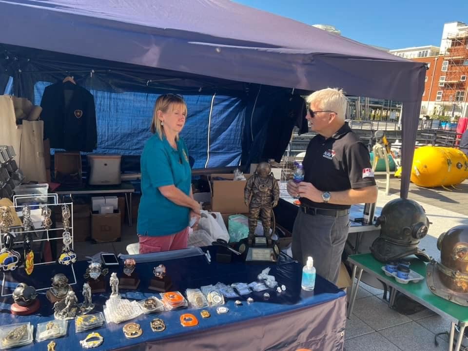 Chris Deere patronising the Divers’ Gifts &amp; Collectables stall at the dedication of the Vernon Mine Warfare &amp; Diving Monument at Gunwharf Quays (formerly HMS VERNON) in Portsmouth.