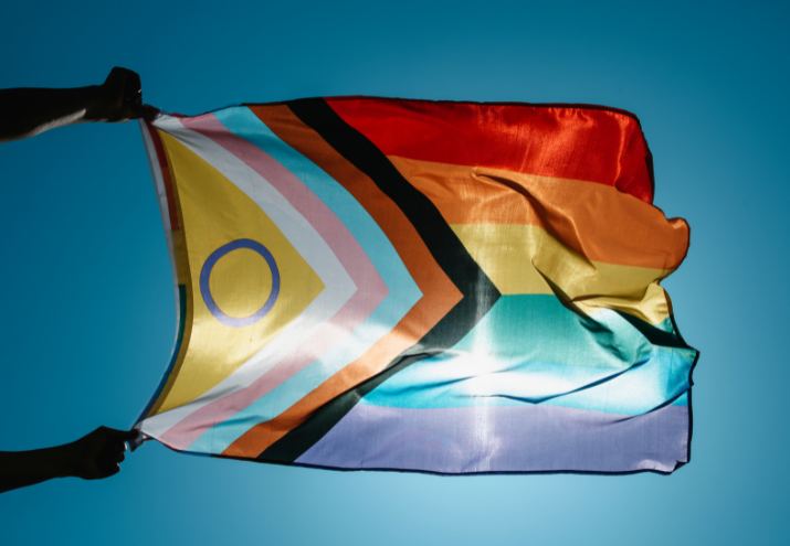 a person flying the pride flag after a minneapolis therapy lgbtq intensive