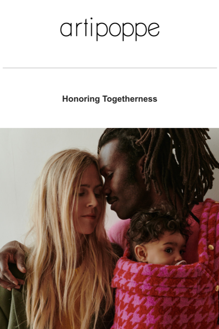 A diverse family of three sharing a close, tender moment with their foreheads and noses touching, expressing love and connection.