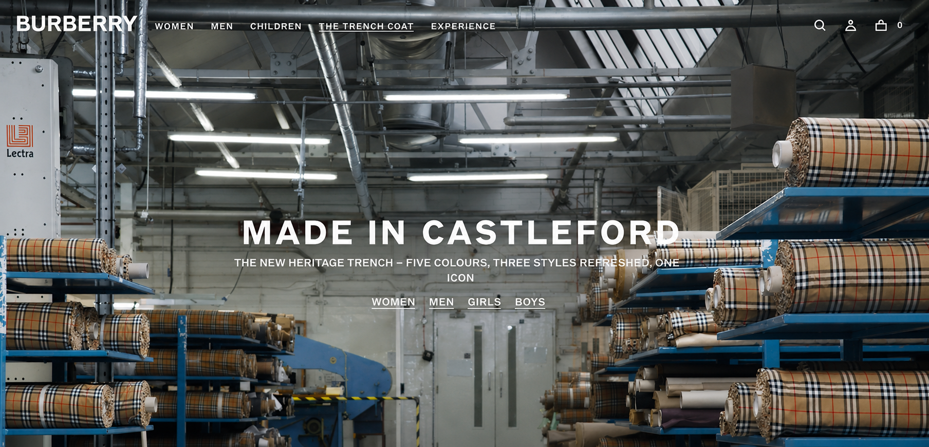 Interior view of a factory or warehouse with shelves full of fabric rolls, featuring a Burberry website homepage with the text 'Made in Castleford' and options for different product categories.