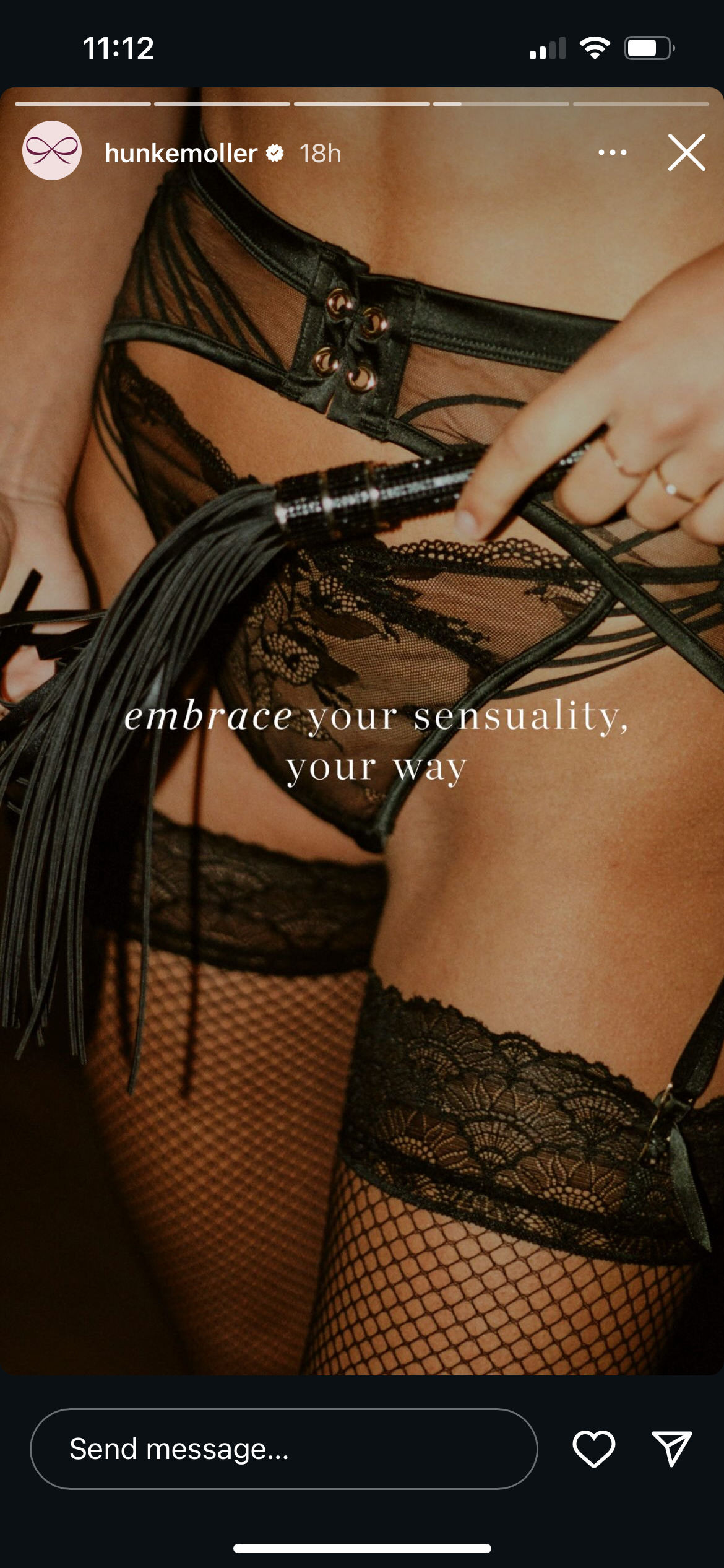A woman wearing black lace lingerie and fishnet stockings, holding leather flogger, with text overlay that says 'embrace your sensuality, your way'.