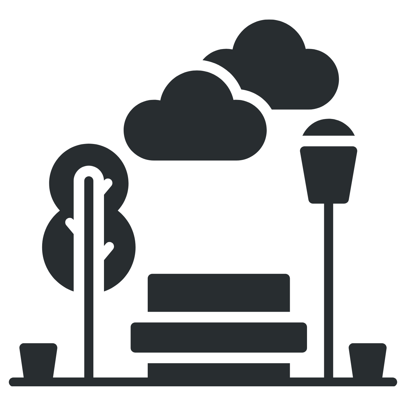 Silhouette of a park bench with trees, clouds, a streetlamp, and small potted plants nearby.