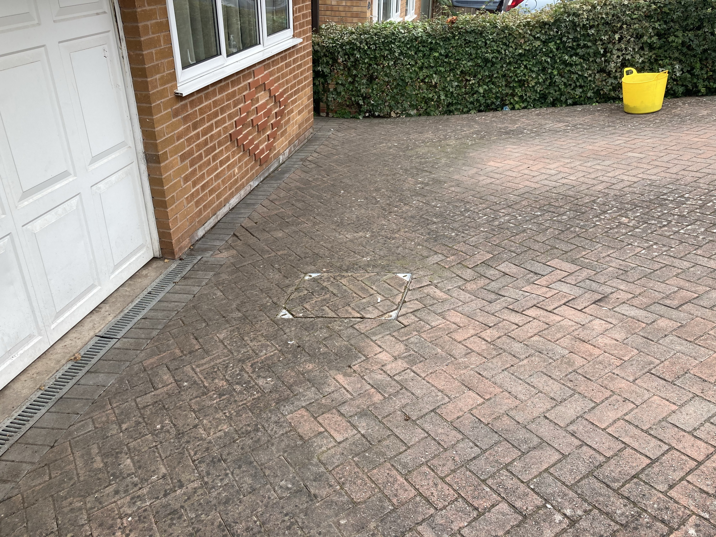 Residential driveway after Jscapes weeding services.png