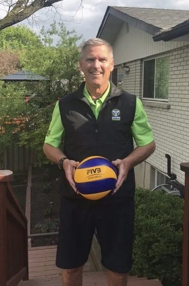 Dean holding volleyball