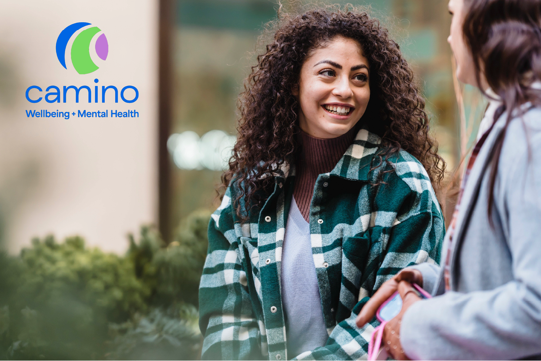 Person smiling and Camino logo