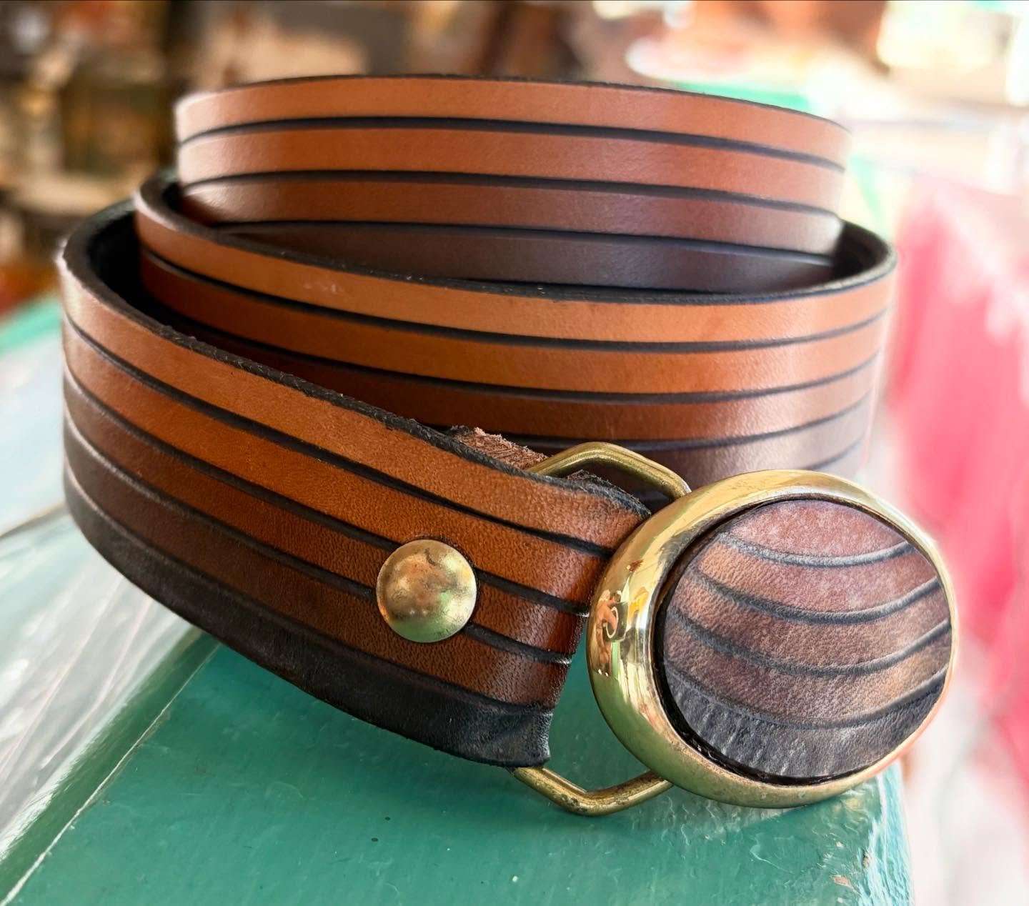 Favorite find this week!  #1983 belt (dated on the coordinating buckle) with graduated stripe. Buckle can be removed. Belt is narrow - 1.25" - perfect for any body type. Currently about a size 36/38 but can be sized up or down if desired. A litt