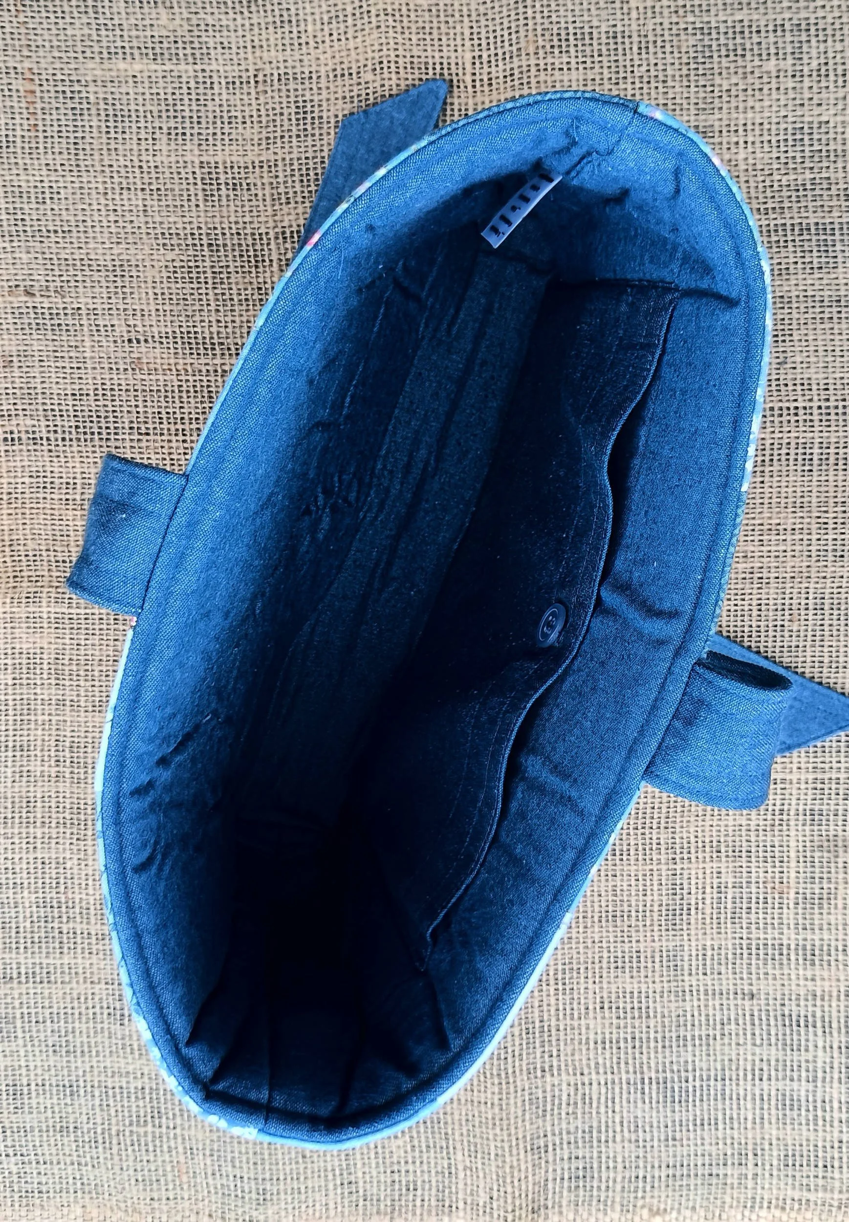 The inside view of a quilted Bible Sleeve made from blue fabrics