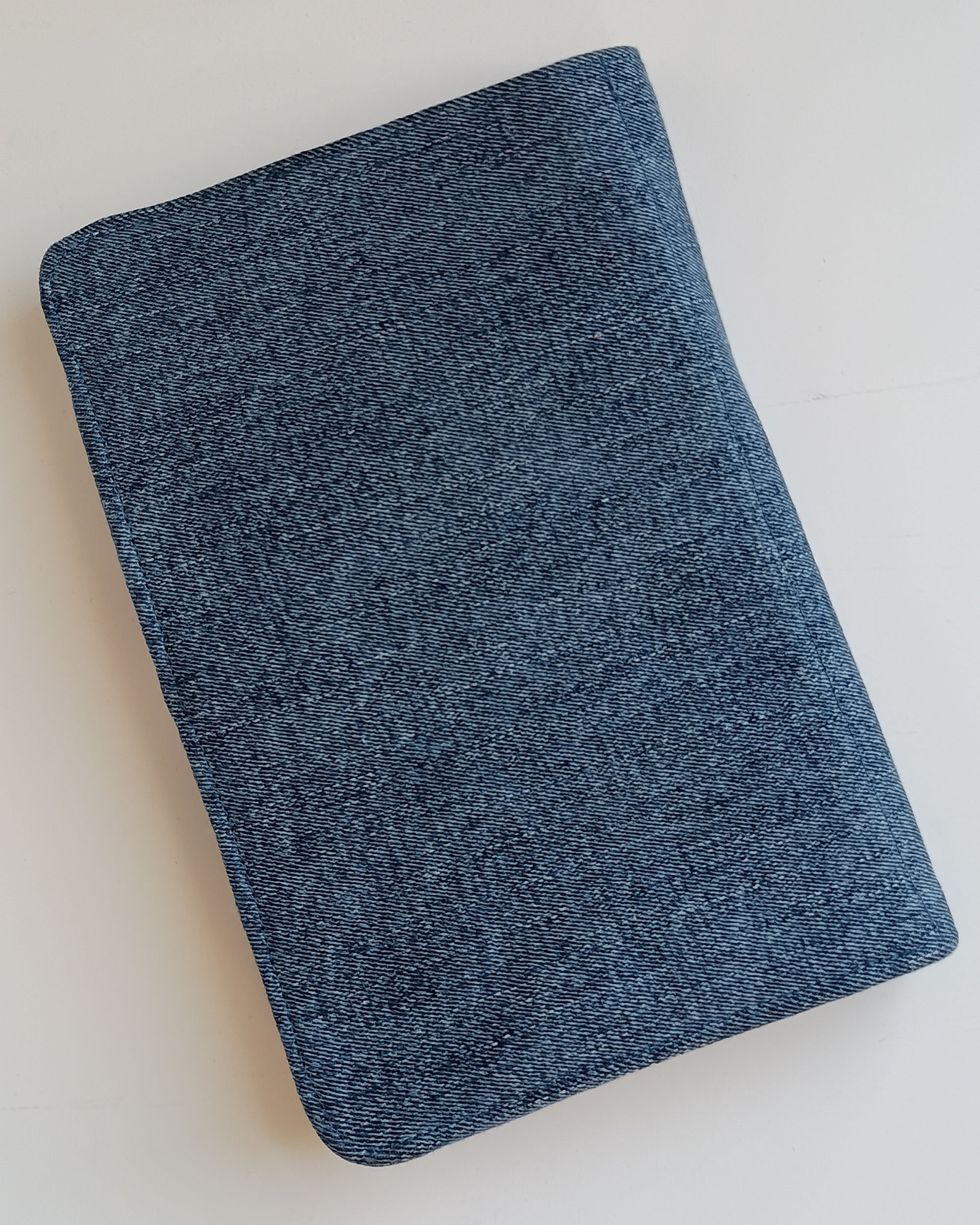 The back side of a notepad cover made of denim fabric