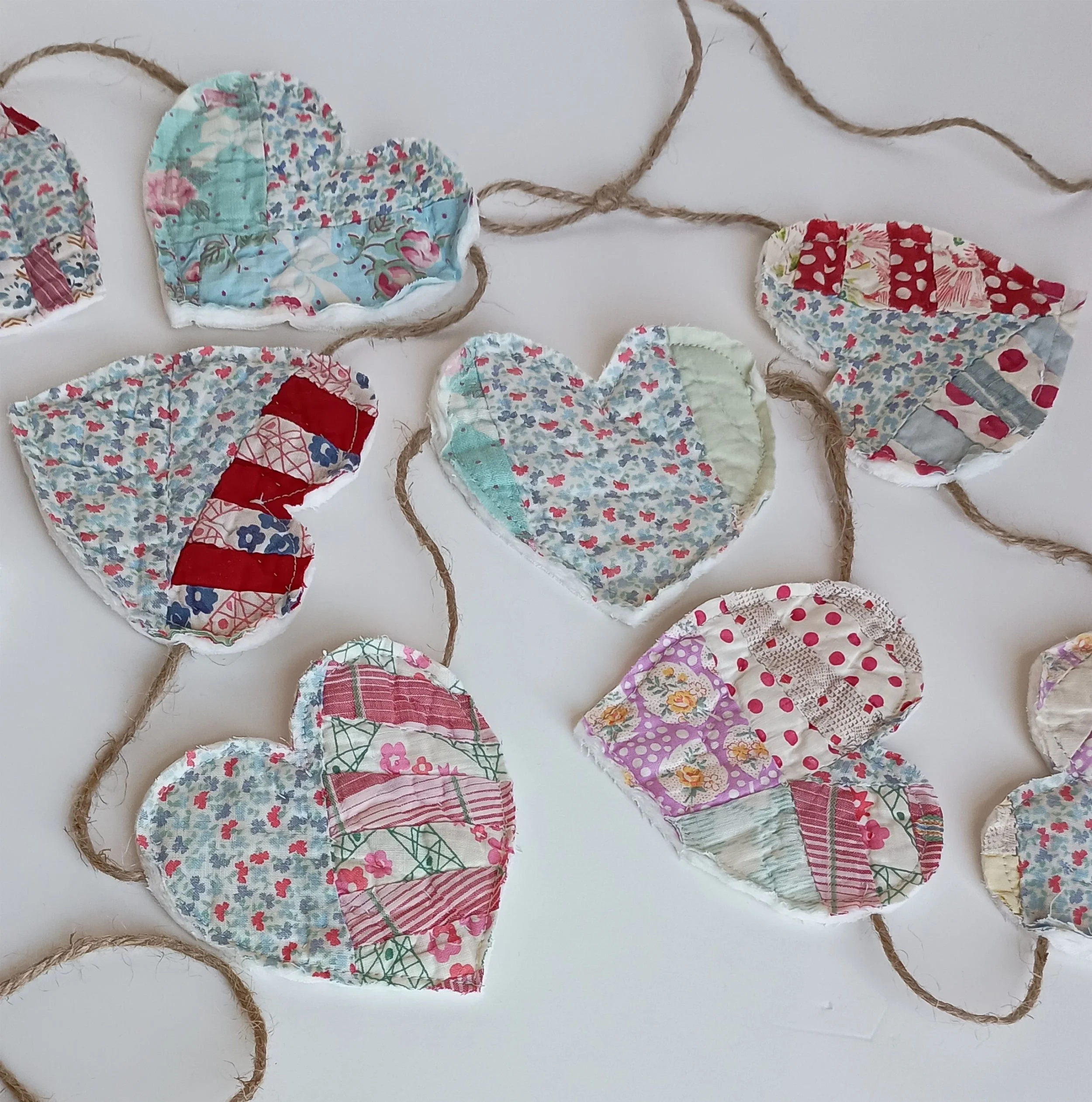 A garland made of jute rope and hearts cut from an antique quilt