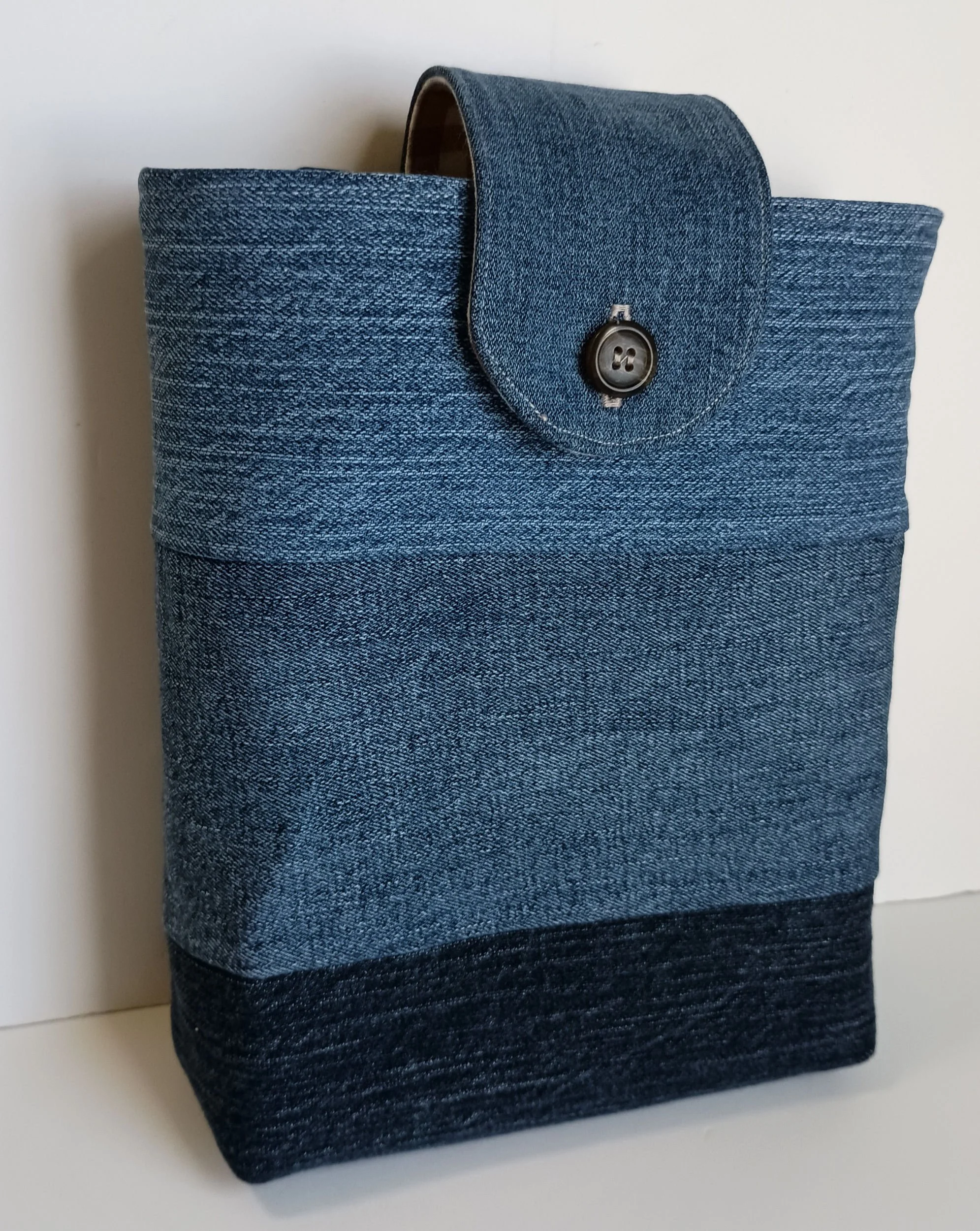 A vertical pouch for holding a Bible or book made from upcycled denim.