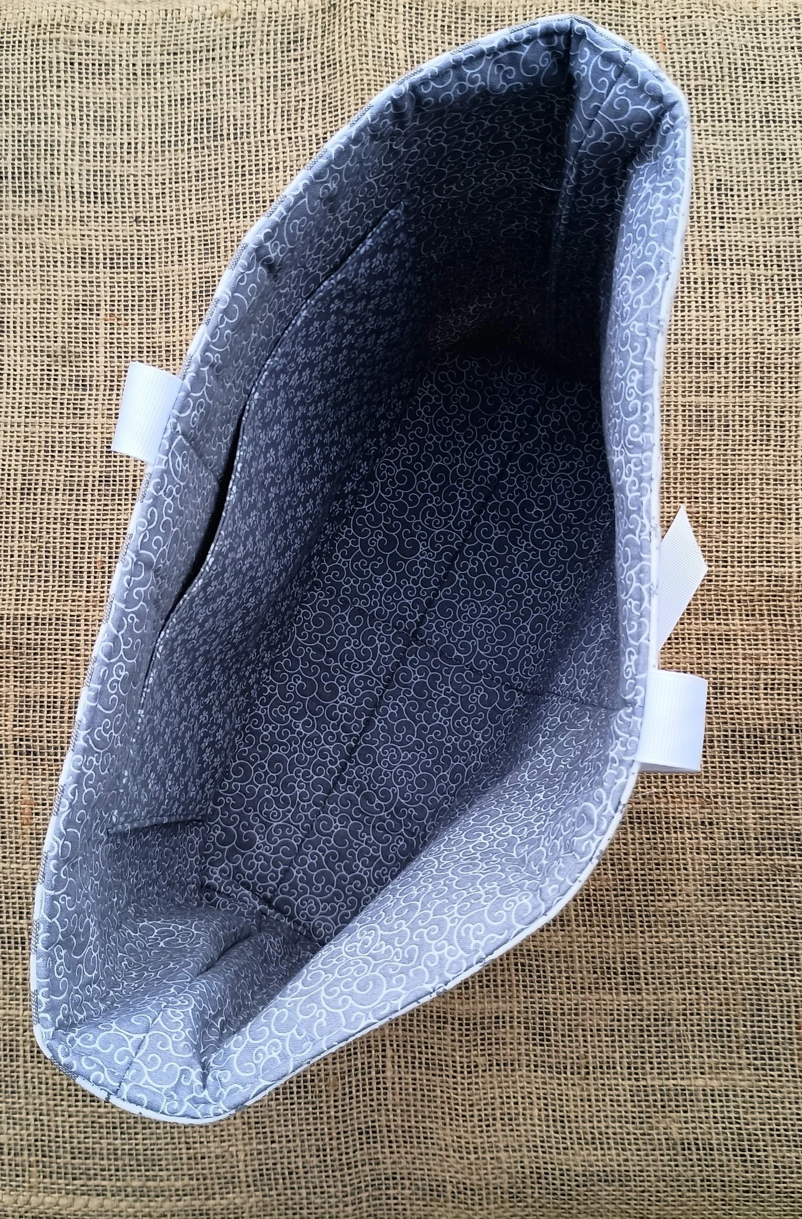 A quilted Bible Sleeve made from gray and white print fabrics