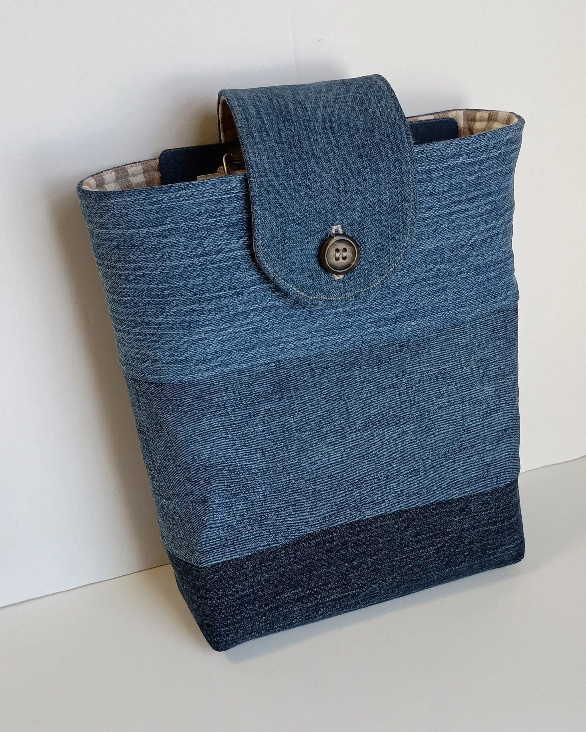 A vertical pouch for holding a Bible or book made from upcycled denim.