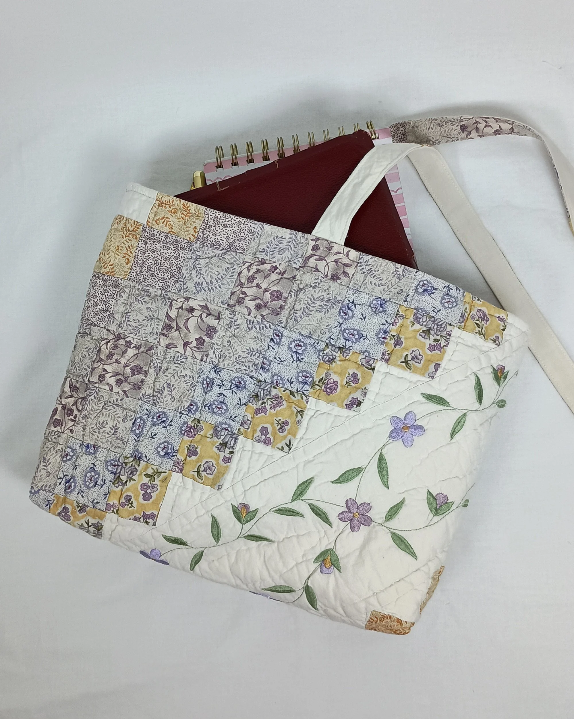 An extra large Bible sleeve with Lavender Floral Embroidery made from a vintage quilt