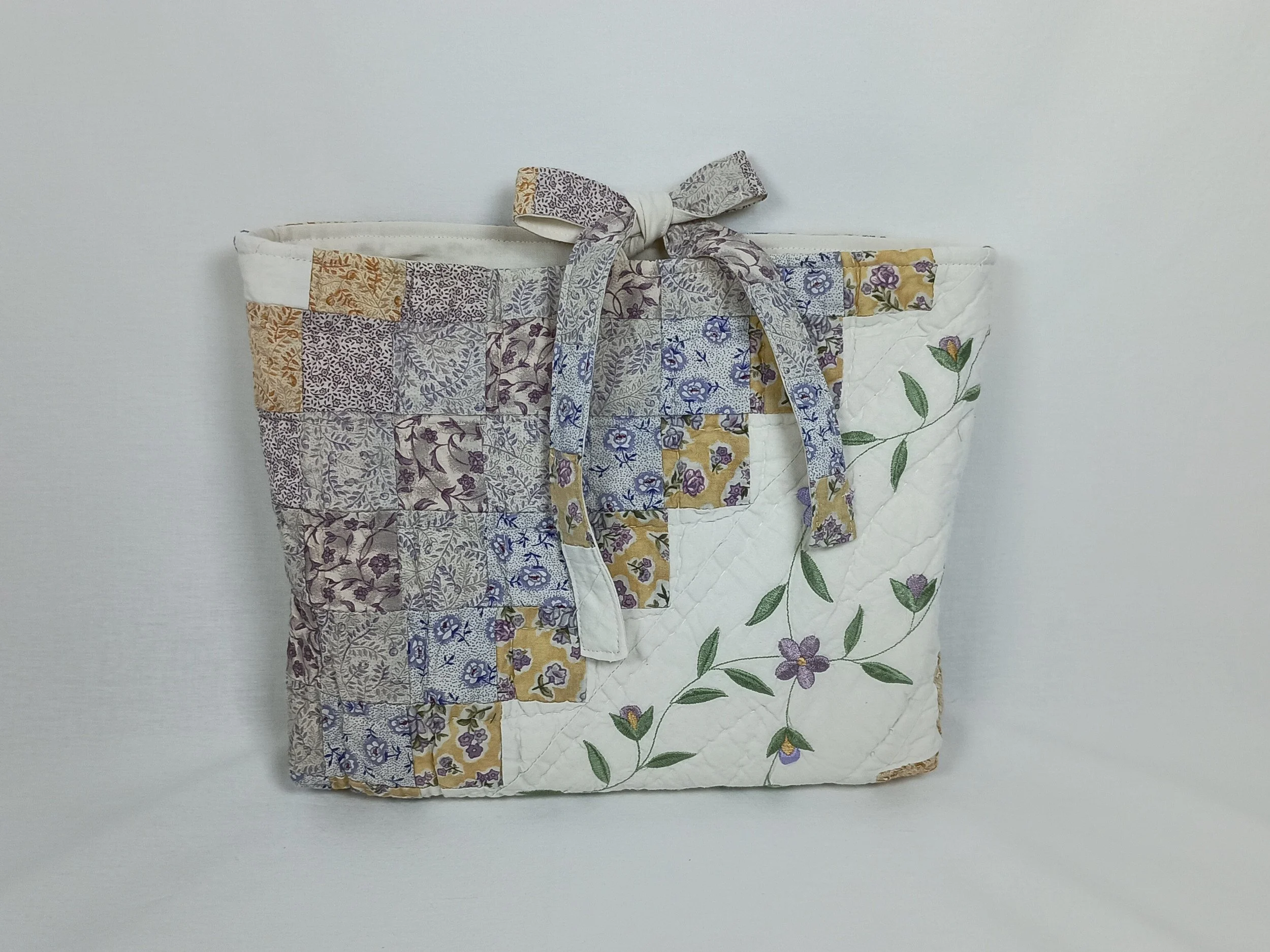 An extra large Bible sleeve with Lavender Floral Embroidery made from a vintage quilt