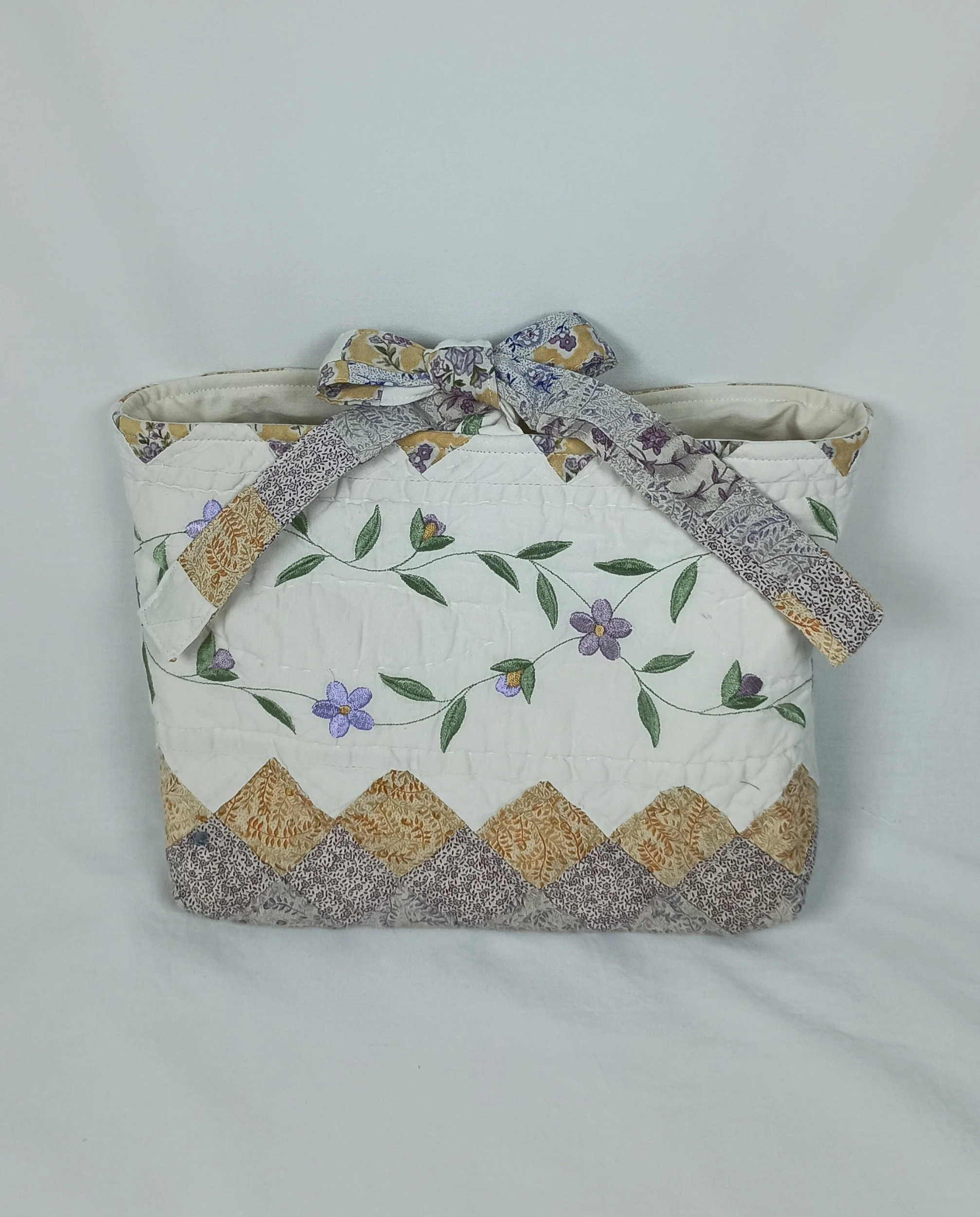 A large Bible sleeve with Lavender Floral Embroidery made from a vintage quilt