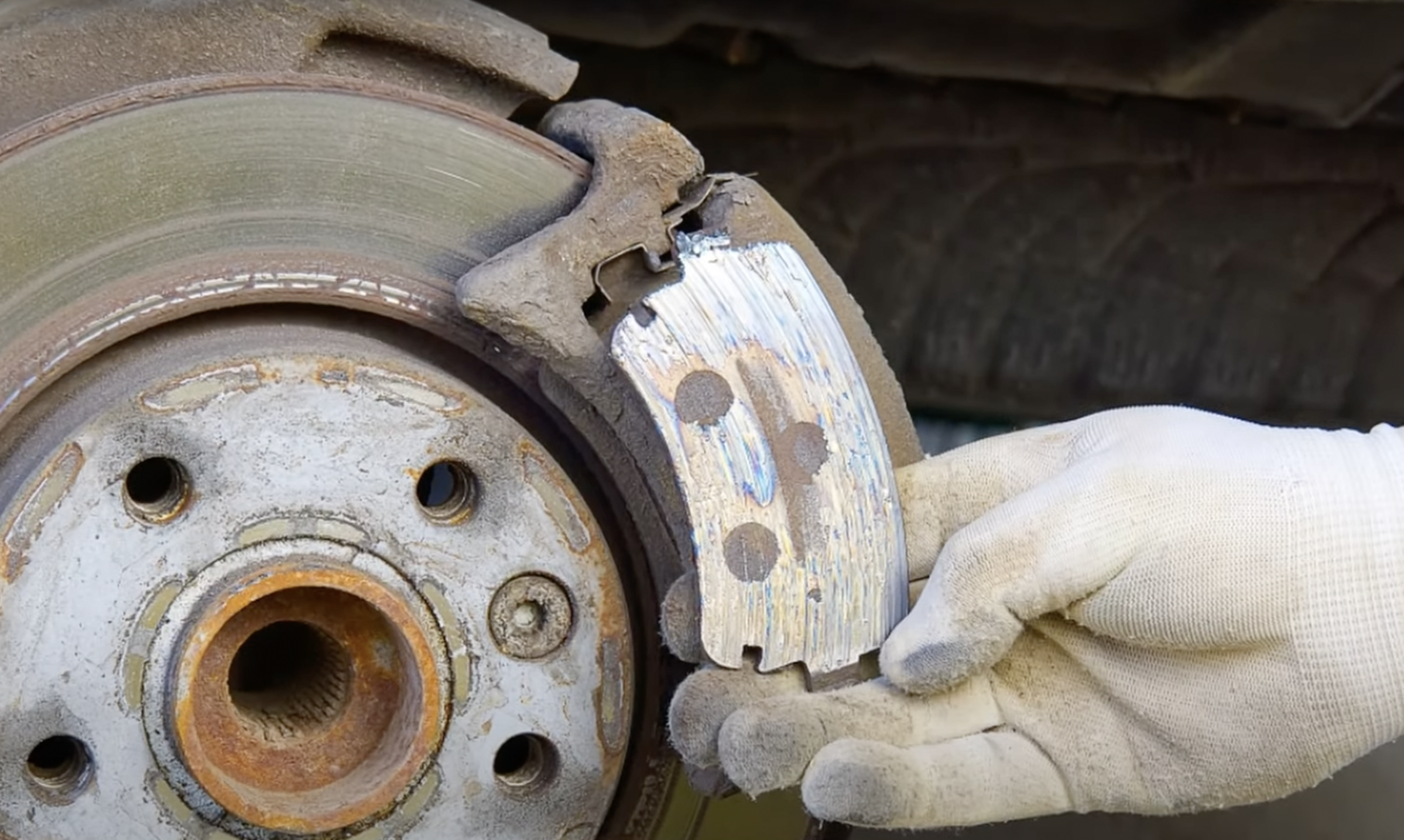 uneven brake pad wear - a symptom of a bad brake caliper