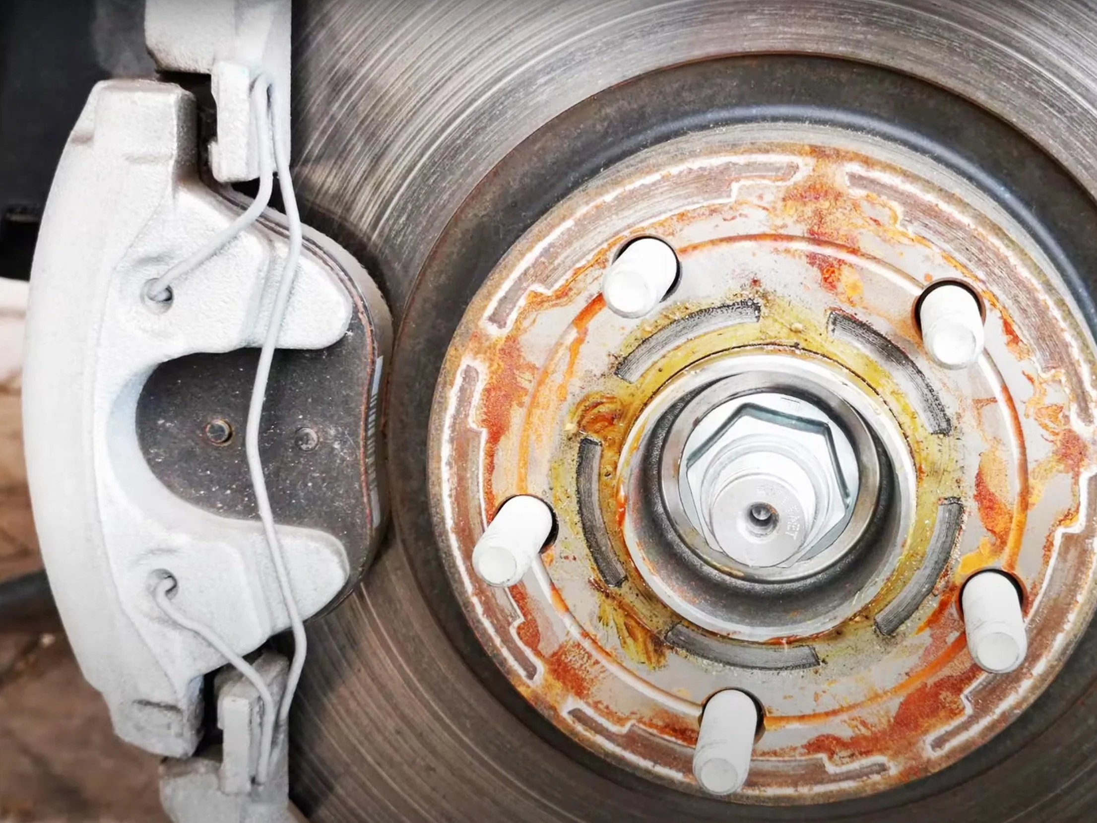 scratched rotor - a symptom of bad brake pads