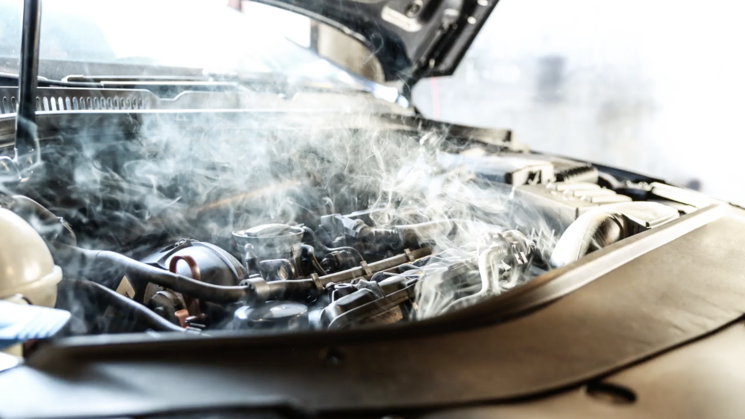 smoke coming from the engine - a symptom of a bad valve cover gasket