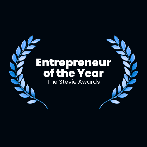 Award logo for the 'Entrepreneur of the Year' at The Stevie Awards, featuring blue laurel branches on a dark background.