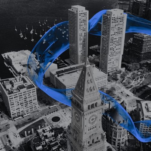 A cityscape with tall buildings and a historic clock tower, with a digital blue wave flowing through the scene.