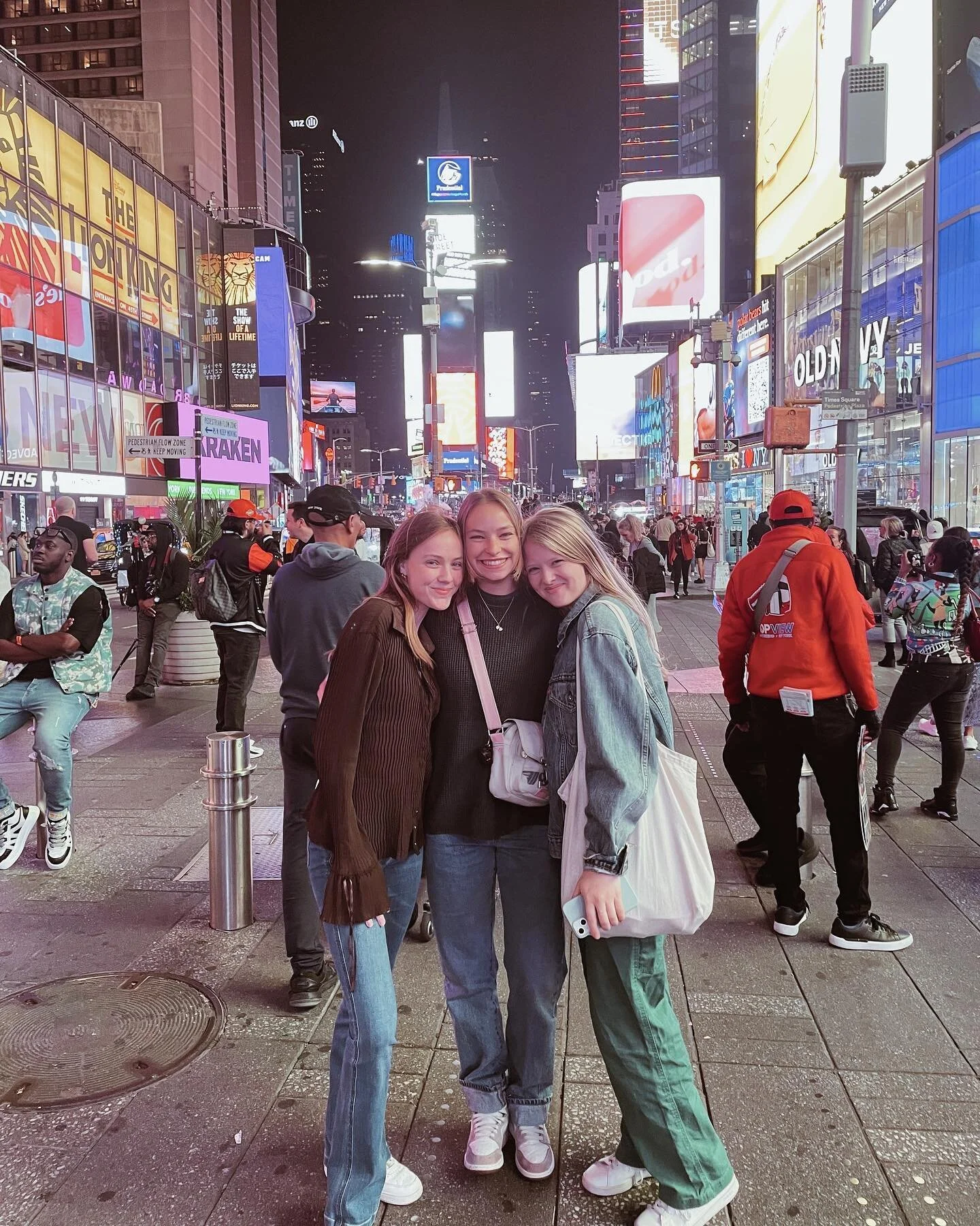 3 squirrels holding hands in times square