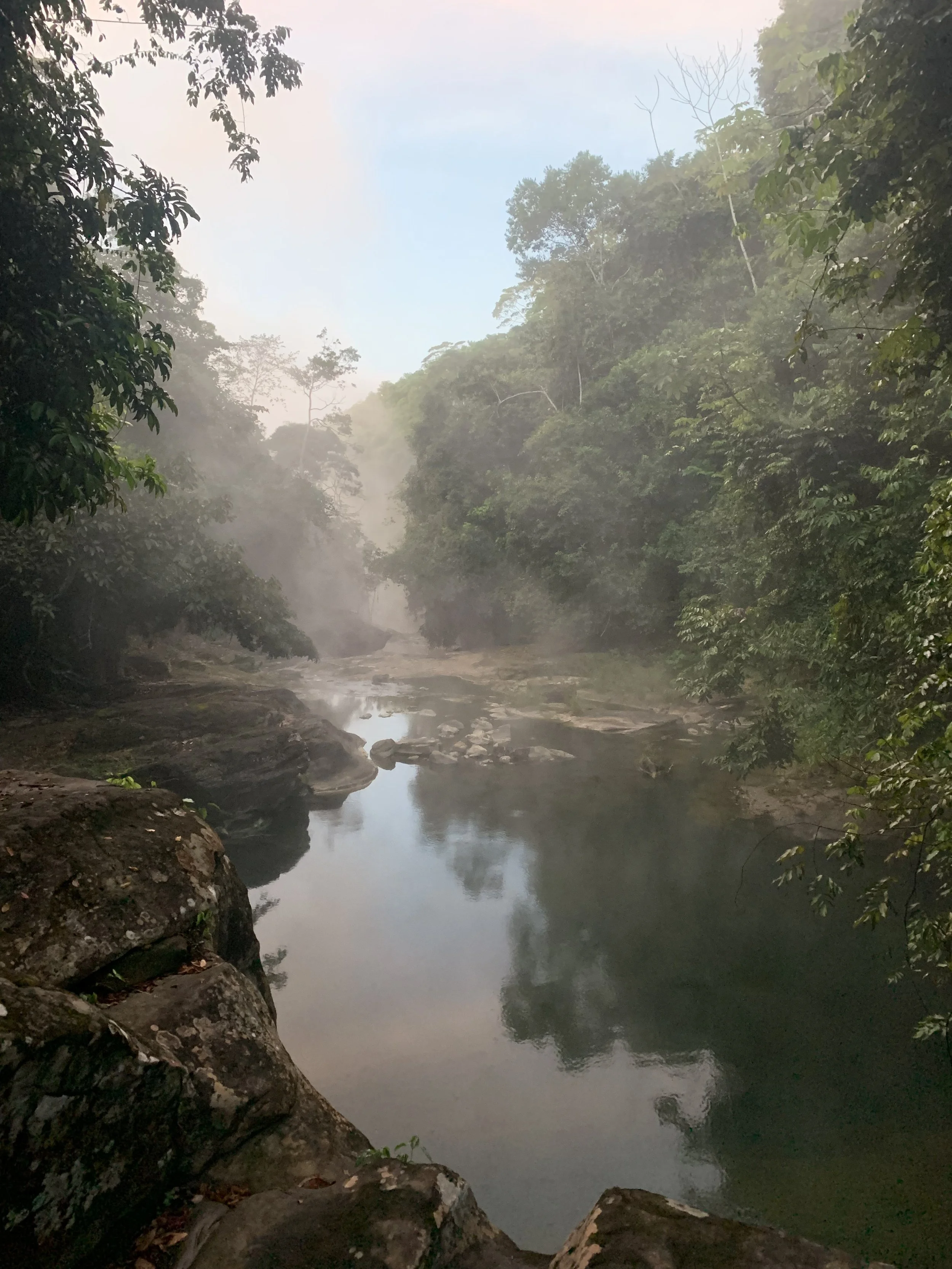 Dusk at a sacred pool of the Boiling River at Mayantuyacu