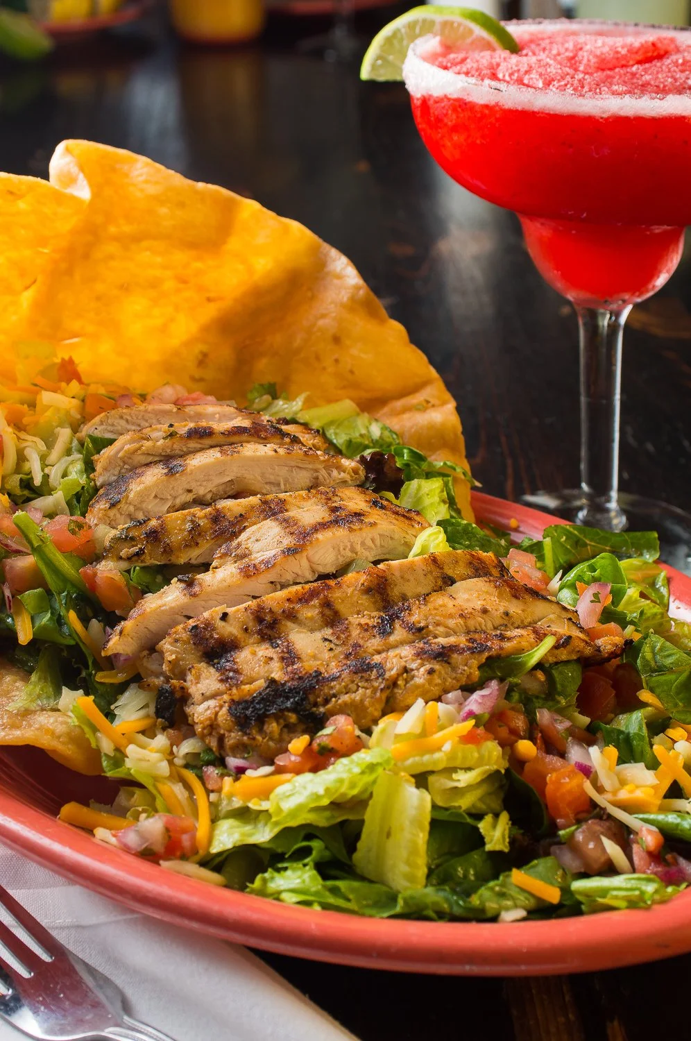 Grilled Chicken over chopped Mexican salad with fried tortilla and a Frozen Strawaberry Daquiri at Rosalita's Roadside Cantina in Englishtown, New Jersey