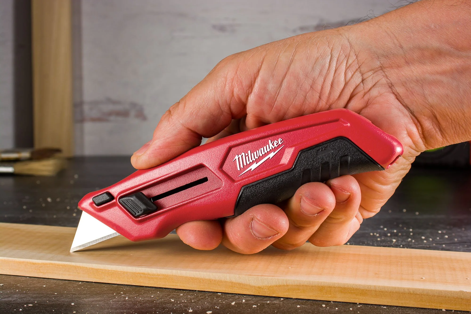Milwaukee Tools Side Slide Utility Knife in use