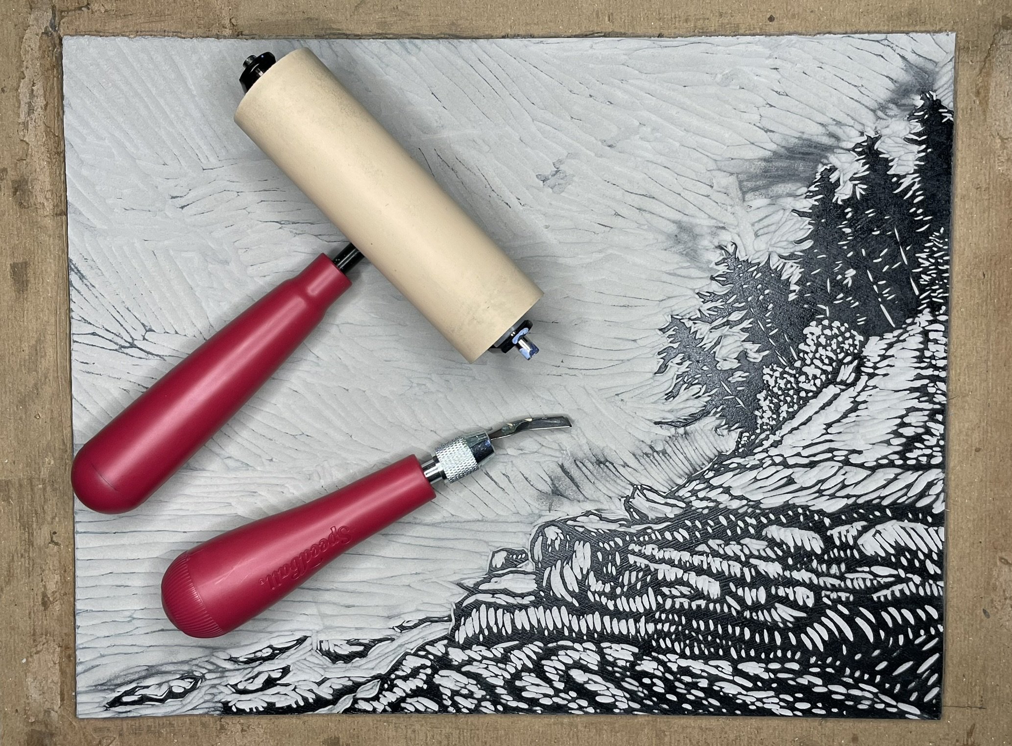 Orcas Coast Linocut with Tools.jpeg