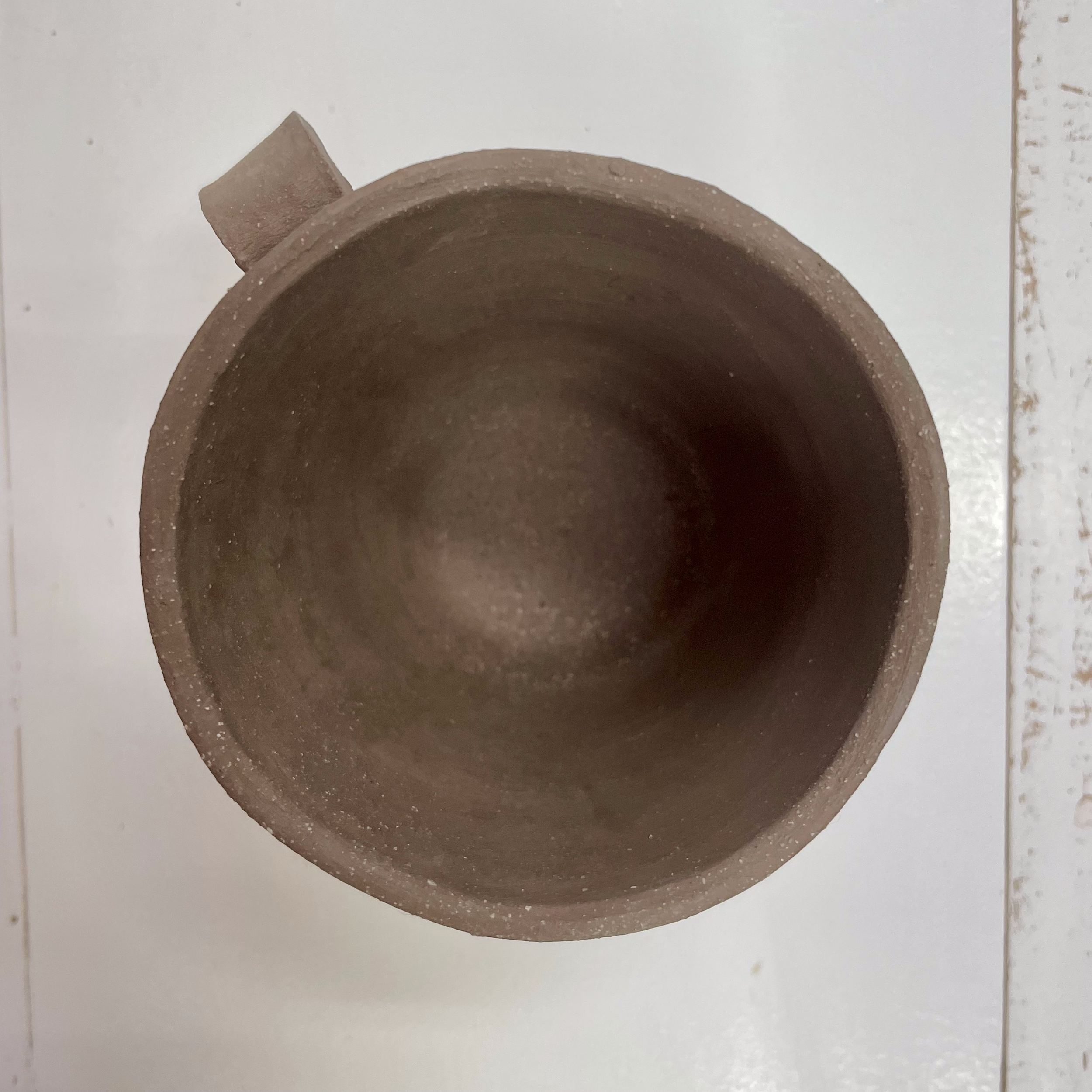 a. first handle for mug
