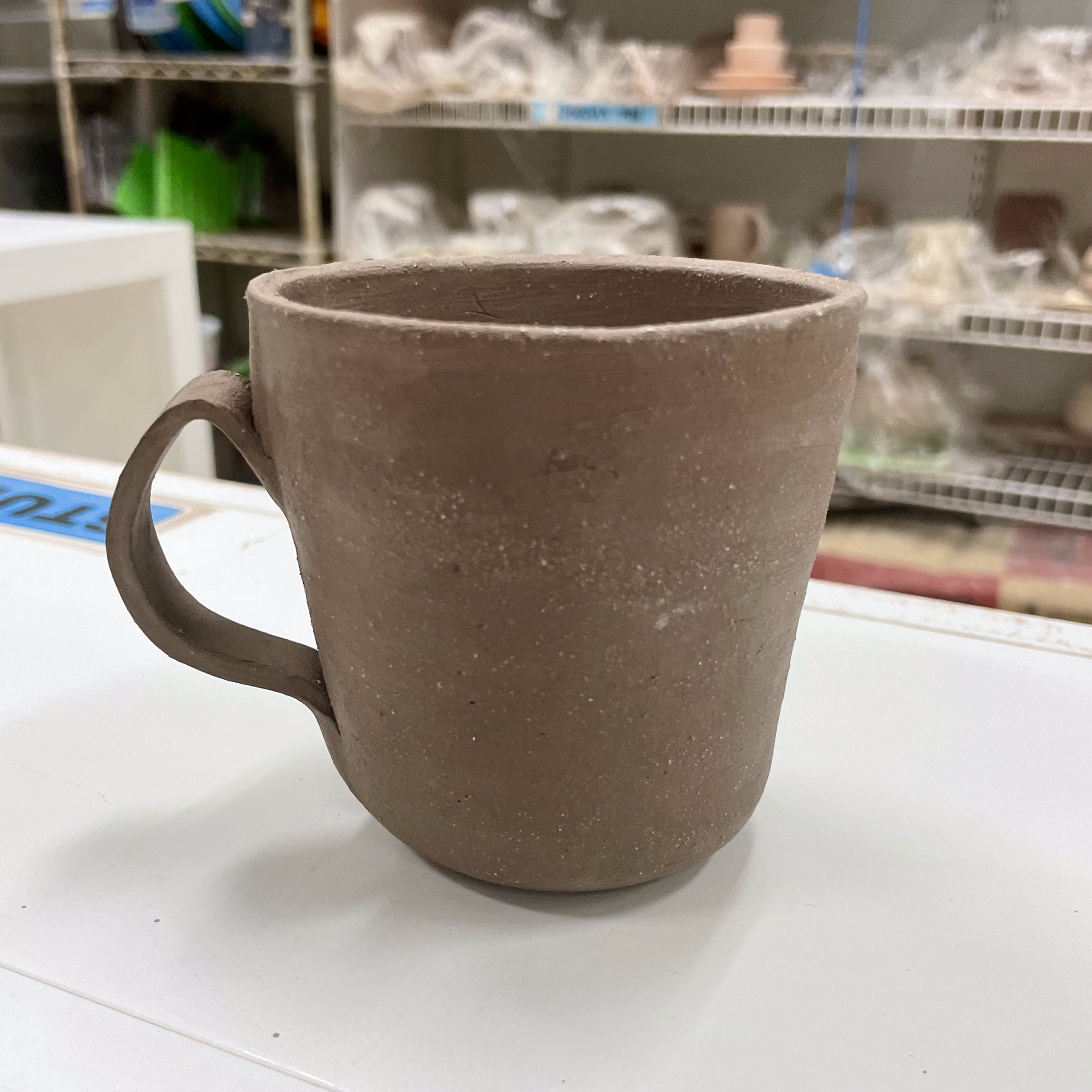 a. first handle for mug