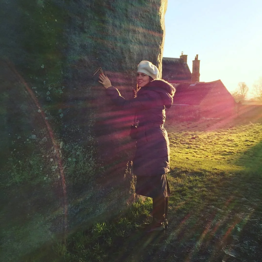 Charging dowsing rods at Avebury Neolithic hedge and stone circle monument, England