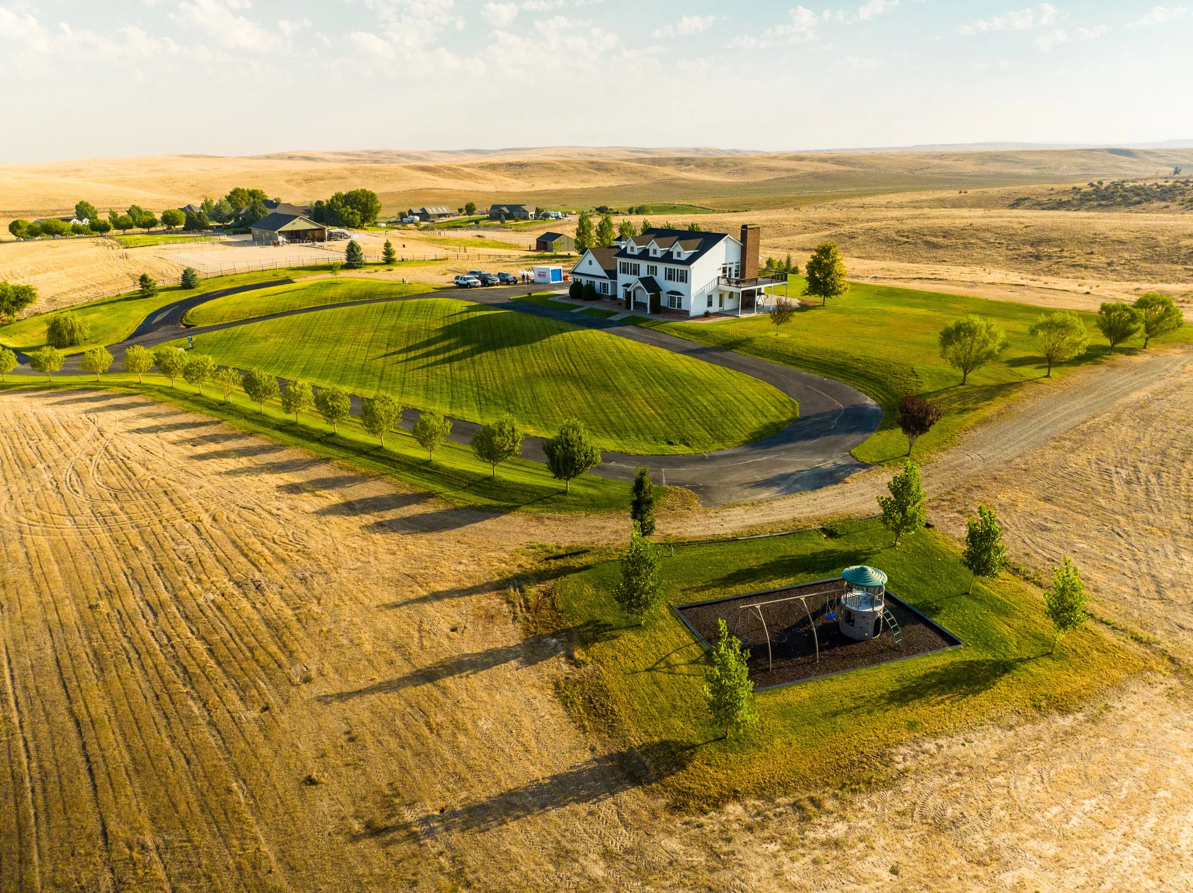 Aerial drone view of a luxury home and surrounding foothills in Boise, Idaho, photographed by Jon Conti Visuals.