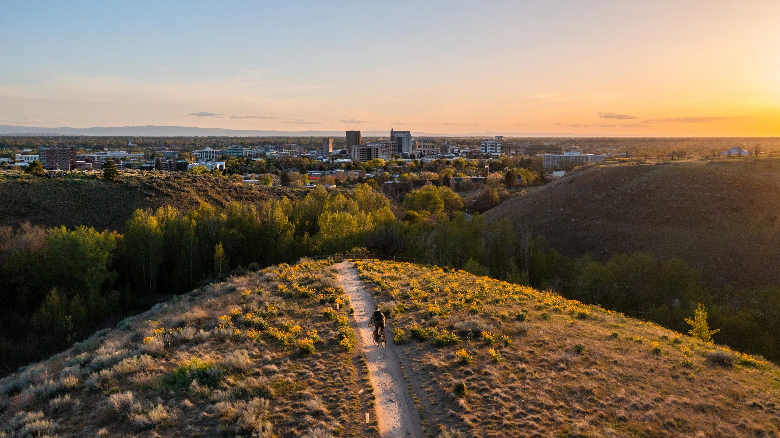 Aerial photo of biker in Boise Foothills in Boise, Idaho — FAA-licensed drone photography by Jon Conti.