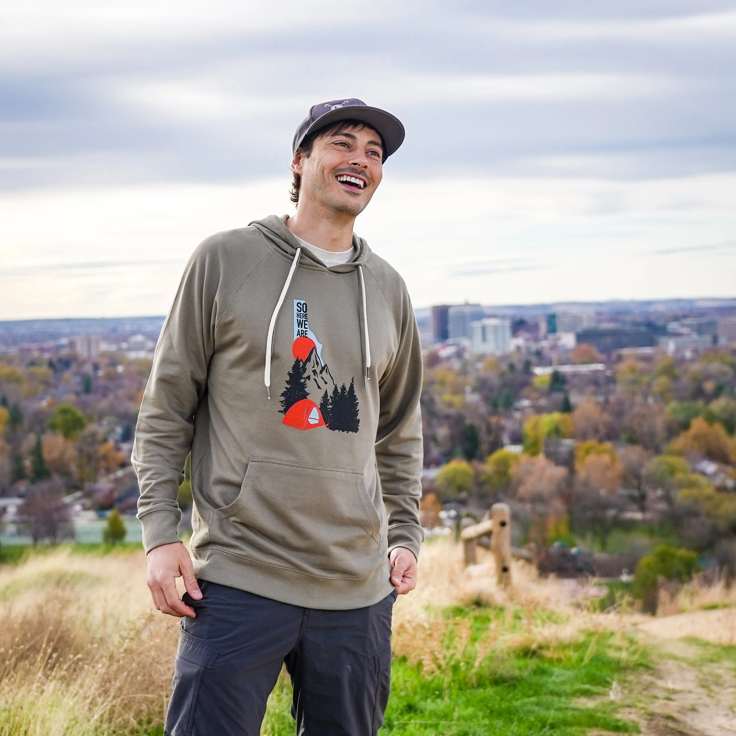 Jon Conti smiling with the Boise, Idaho skyline in the background.
