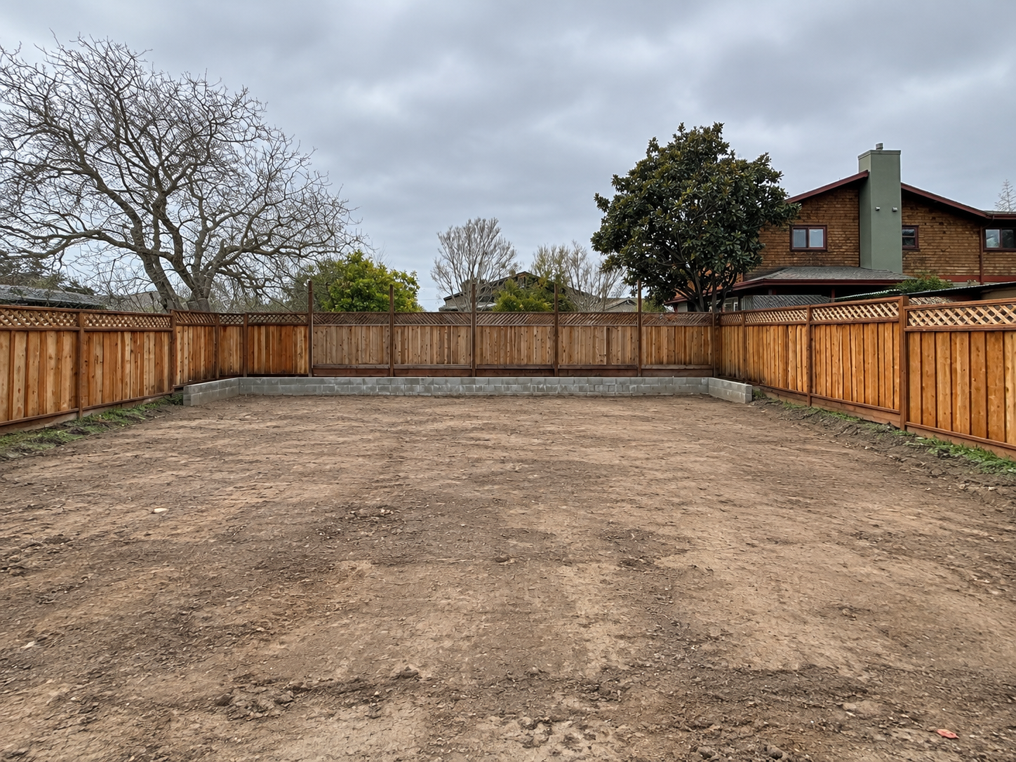 Backyard site preparation before foundation excavation.
