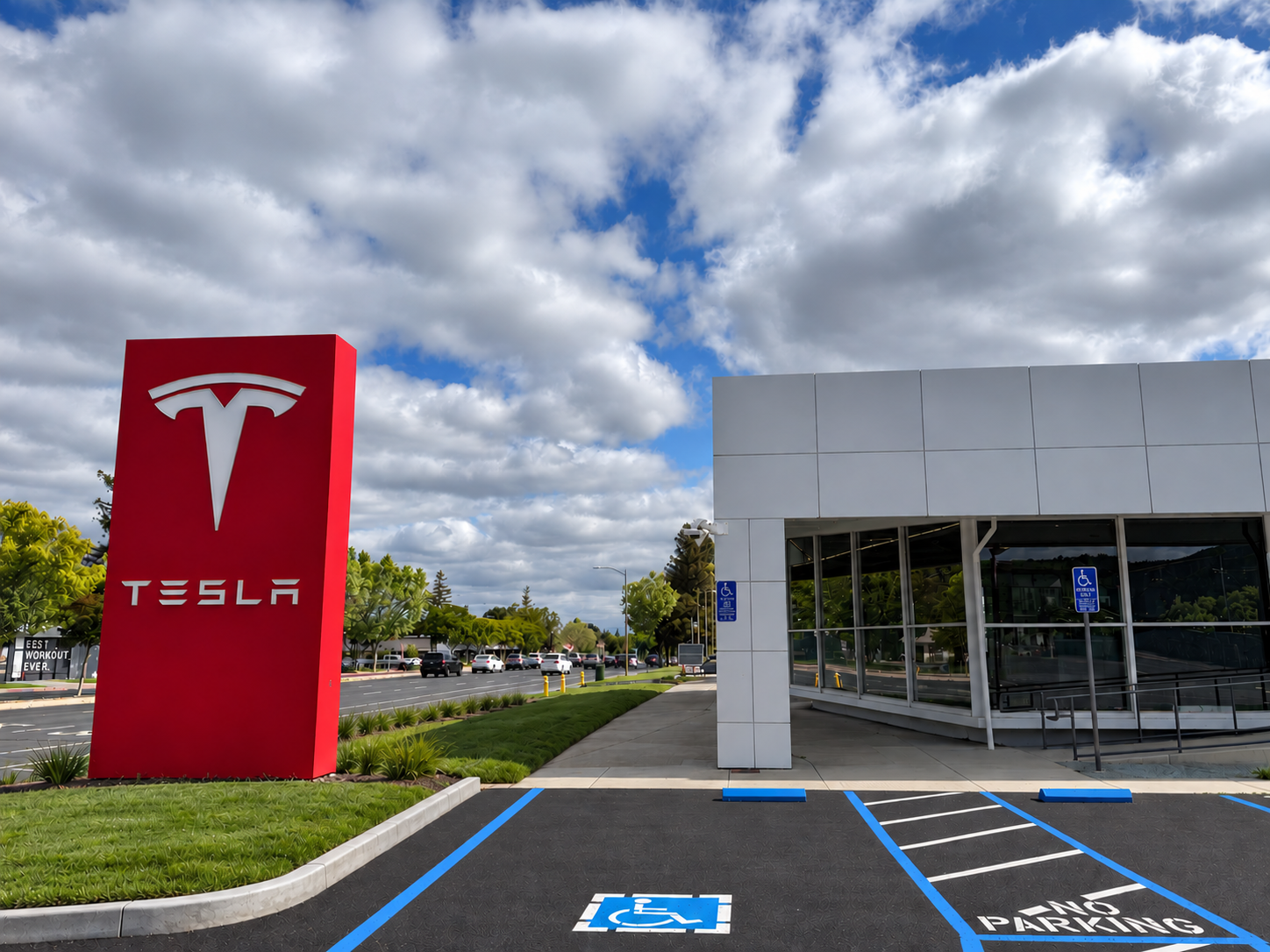 Los Gatos, CA — Concrete entrance ramp, walkway, and curbs at a Tesla facility.