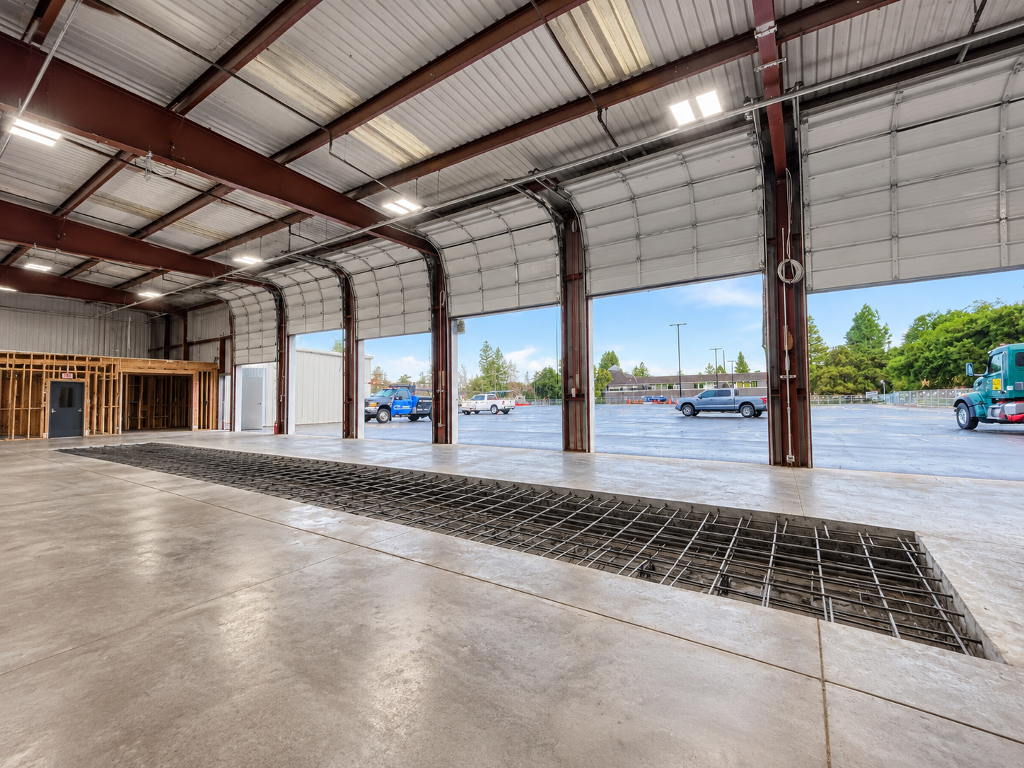 Footing excavation and reinforcing steel for a Tesla service facility.