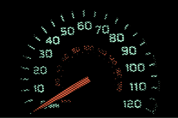 A close-up of a speedometer needle resting at zero mph, symbolizing the stalled progress and lack of asset velocity caused by traditional video podcast post-production workflows.