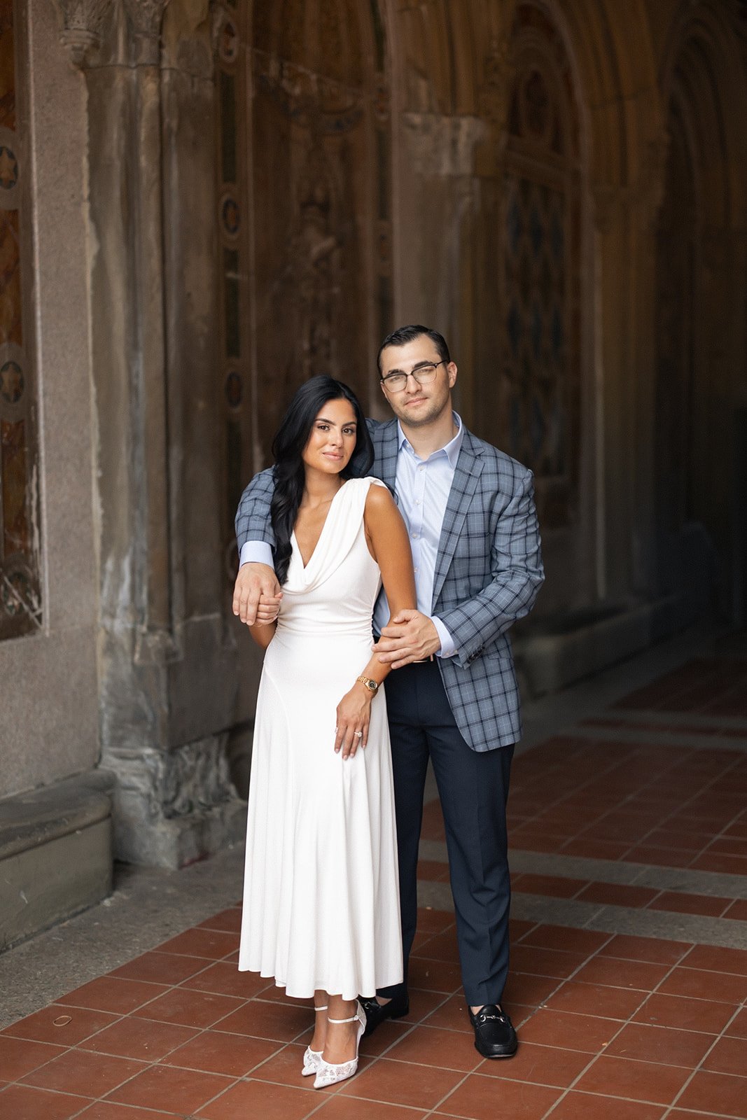 Styling for engagement shoot in NYC. Woman wearing a white midi cowl neck dress styled by good lines styling